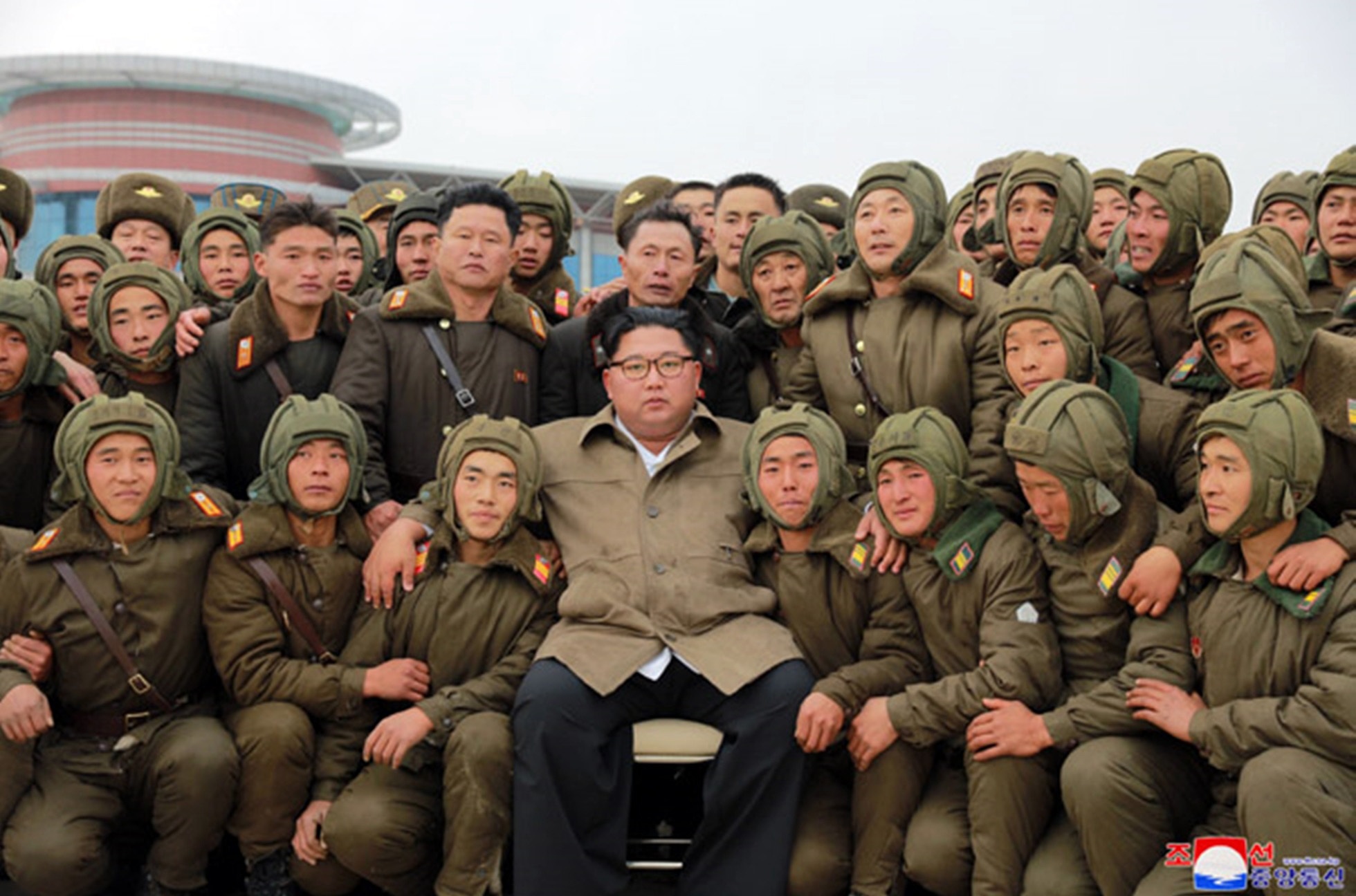 North Korean leader Kim Jong-un poses for a group photo with sharpshooters of the North's Air and Anti-Aircraft Force (Picture: KCNA via PA).