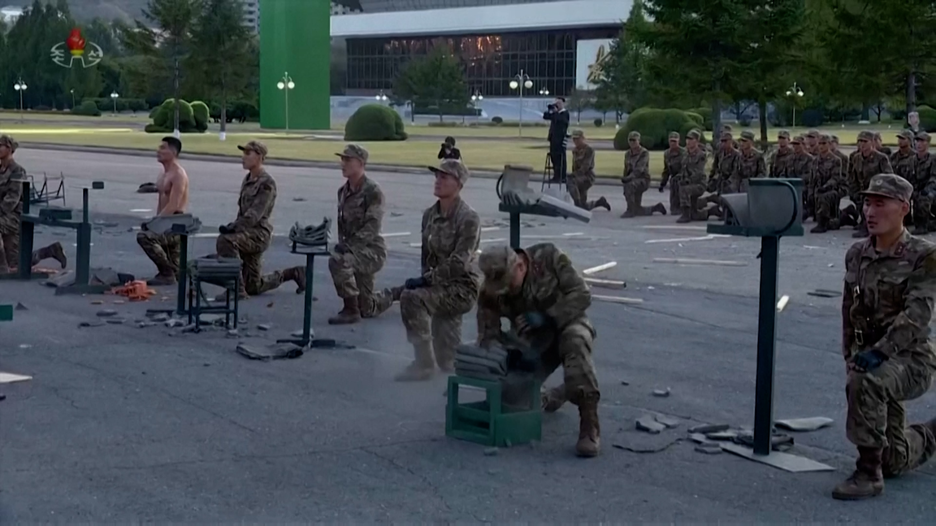 The soldiers smashed through bricks, blocks and tiles during the demonstration in front of Kim Jong Un
