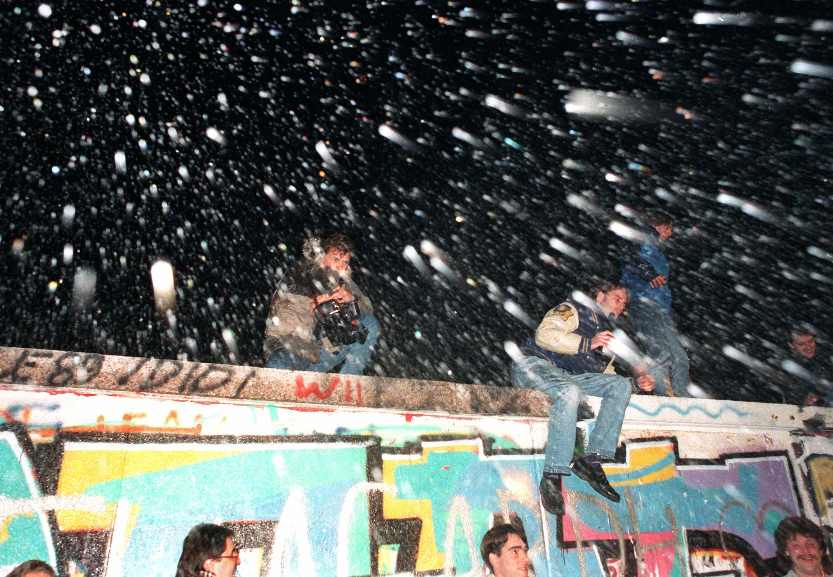 Not even water cannons were able to impress the celebrating people the fall of the Berlin Wall, Germany 100989 CREDIT PA.jpg