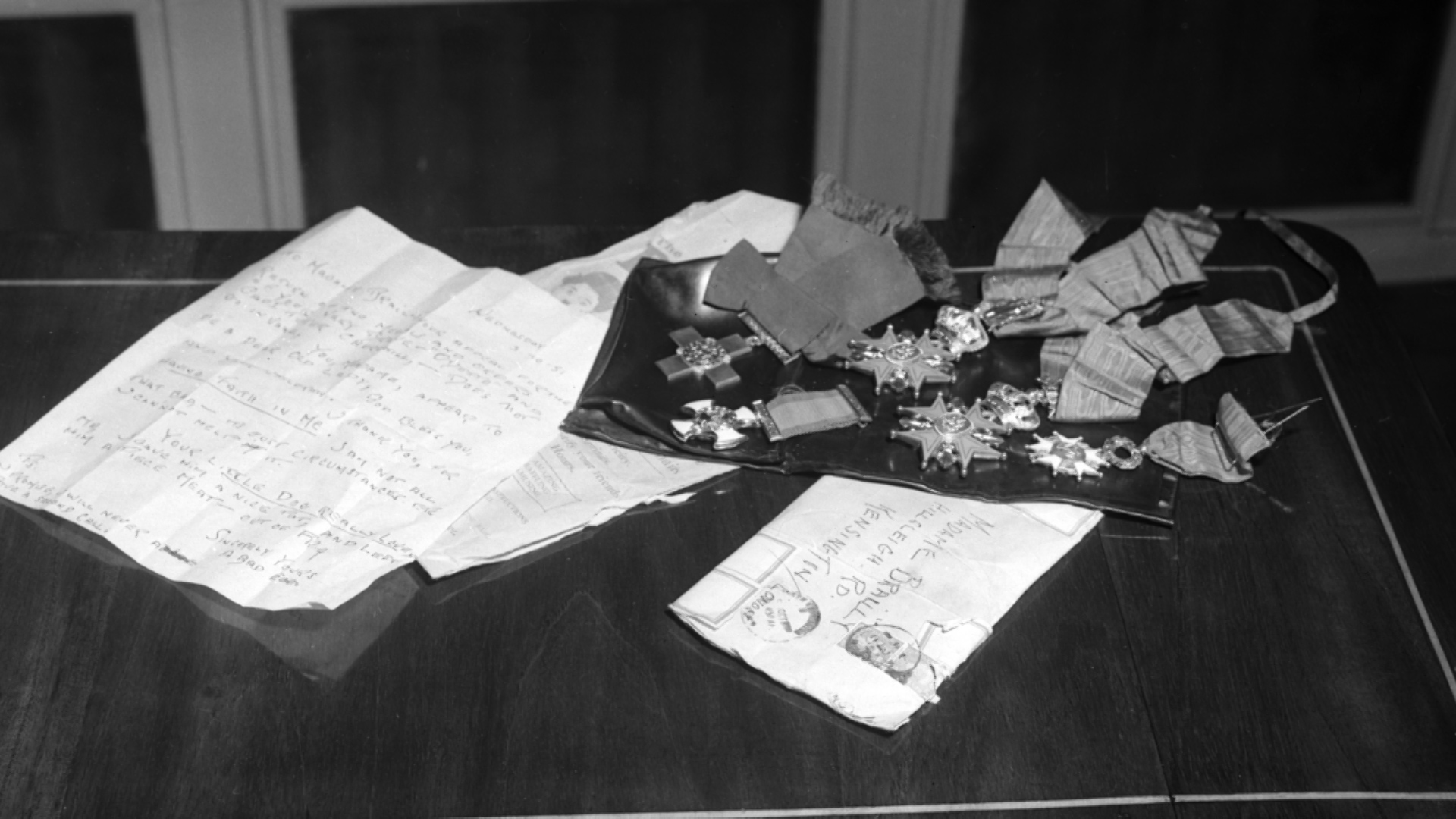 The letter and medals which were returned to Odette and Peter after they were stolen by thieves (Picture: Mirrorpix).
