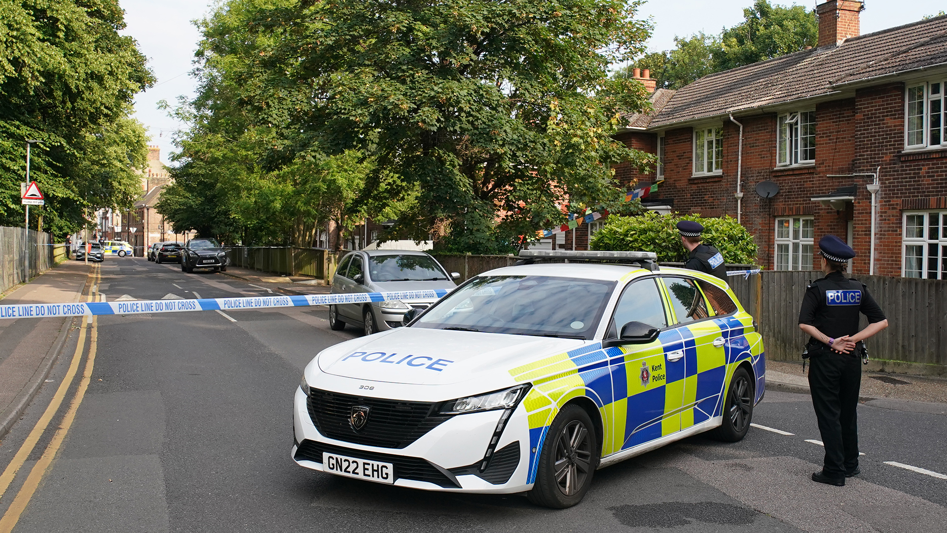 Officers at the scene in Sally Port Gardens 250724 CREDIT PA.jpg