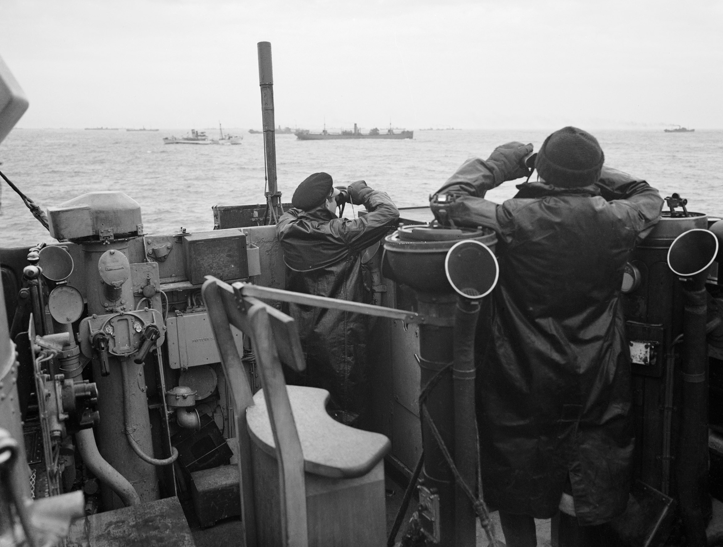 Officers on a destroyer keep lookout over a convoy in the Atlantic in October 1941 (Picture: Royal Navy).