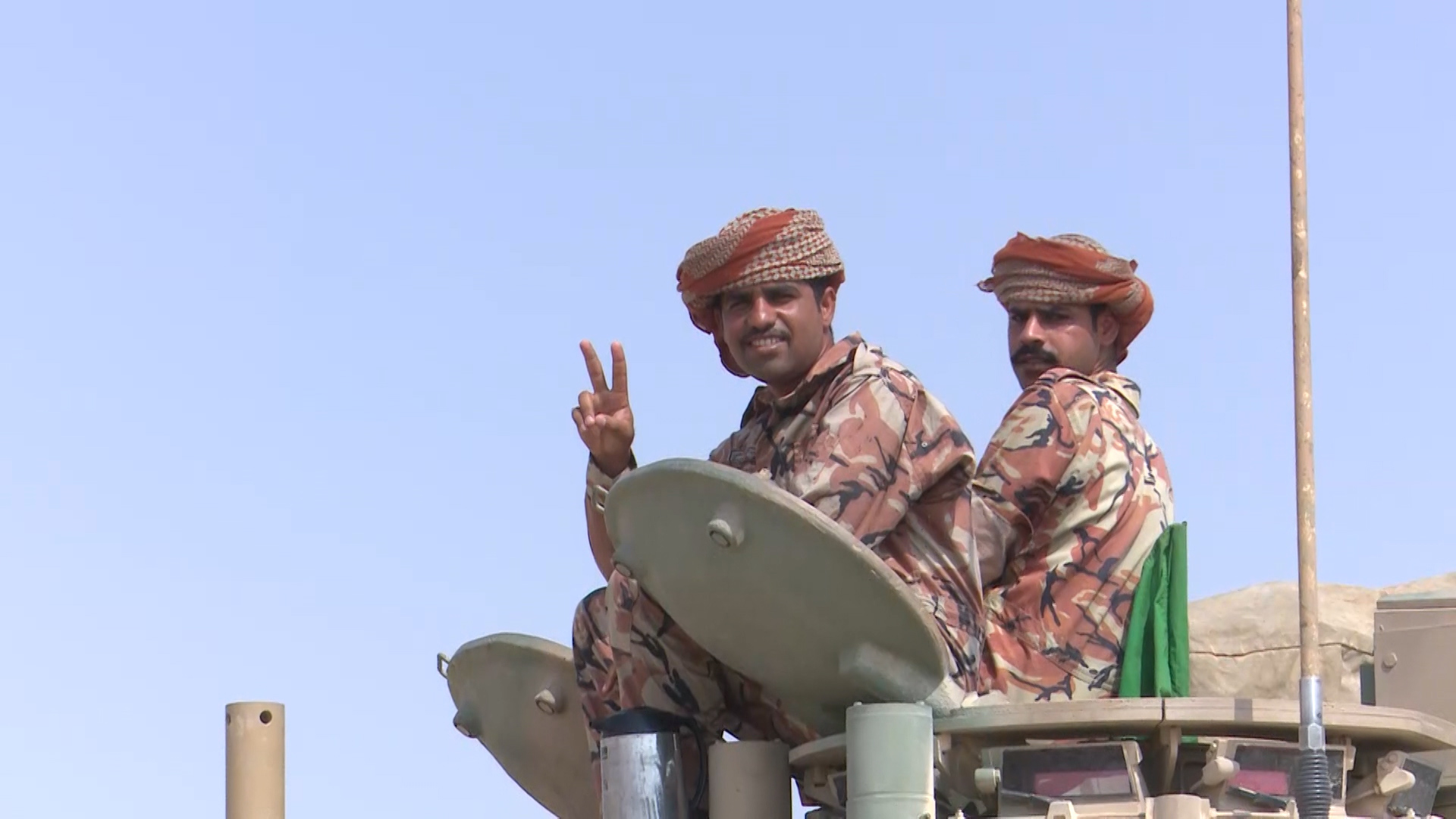 Omani troops on their Challenger 2 tanks