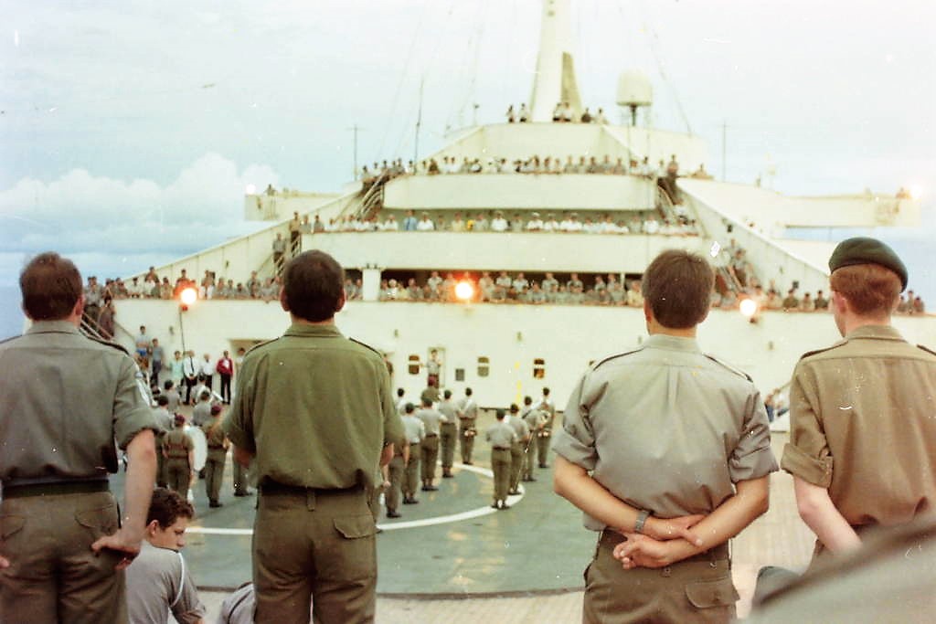 On board Canberra for sun down ceremony with Royal Marines, 1982.