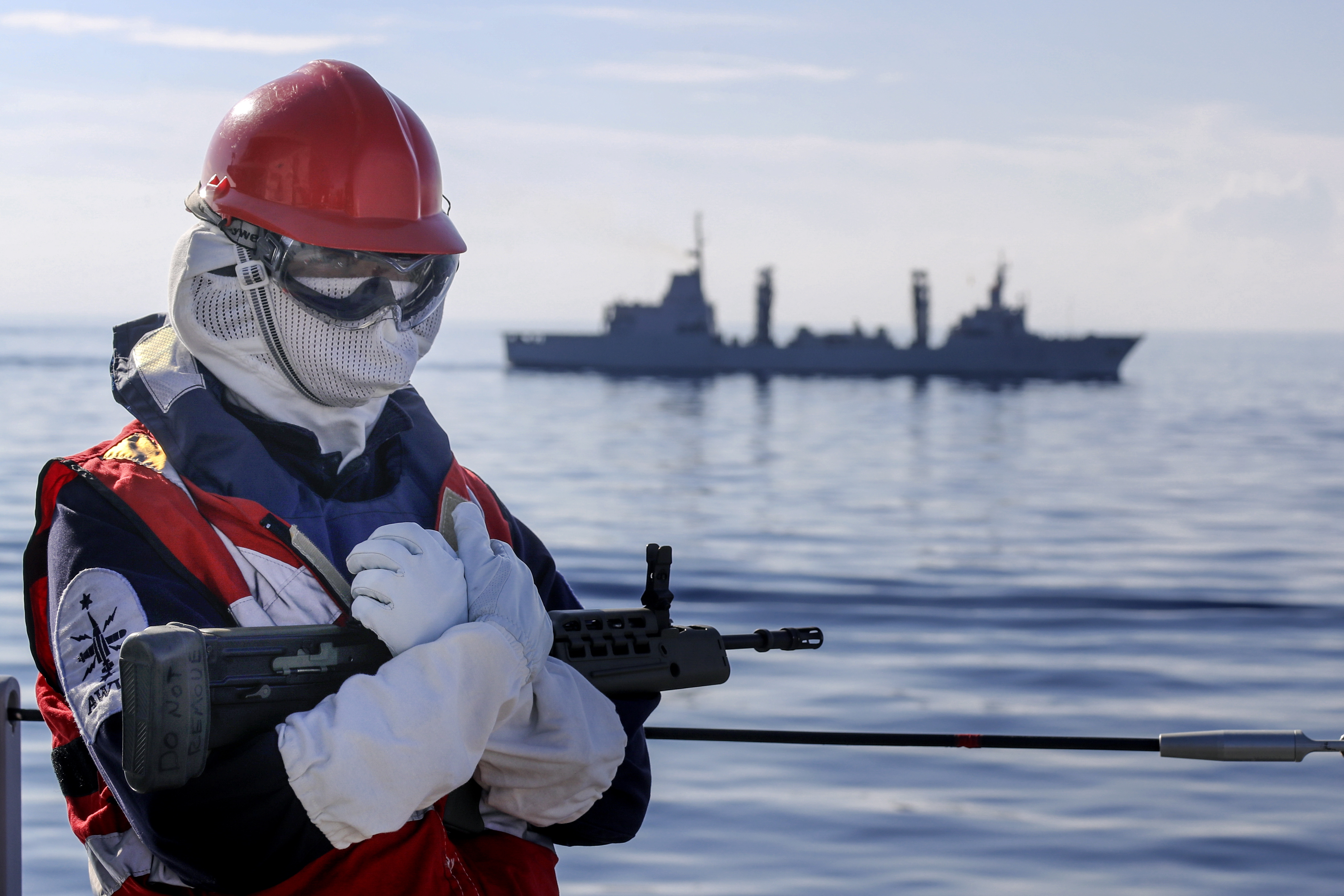 Cover image: Sailor on board HMS Albion as  tanker ESPS Patino sails past in the background (Picture: Royal Navy).
