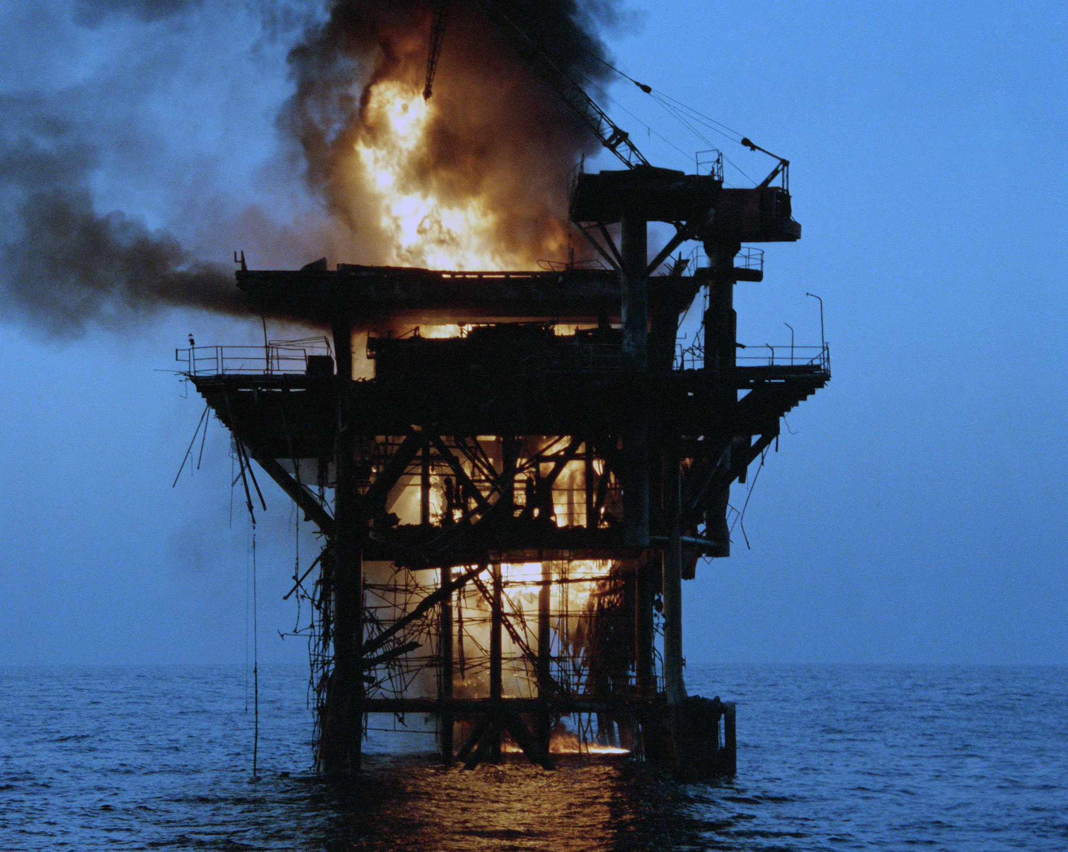 Iranian oil platform on fire after being shelled by five US frigates. (Image: US Navy)