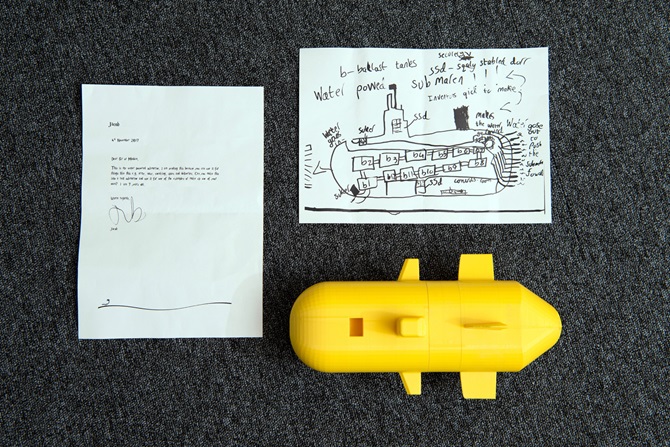 Model submarine and child letter