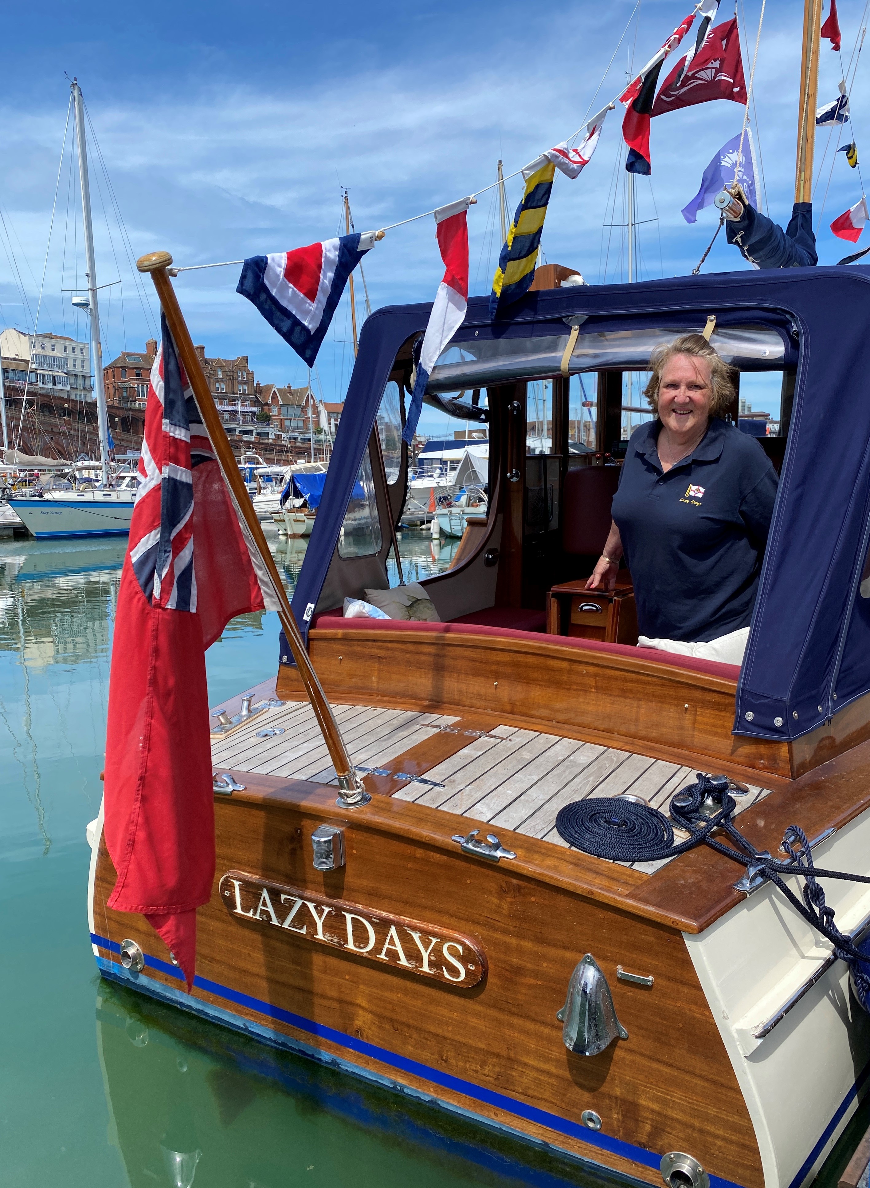 Owner Jill Finn alongside Lazy Days little ship.