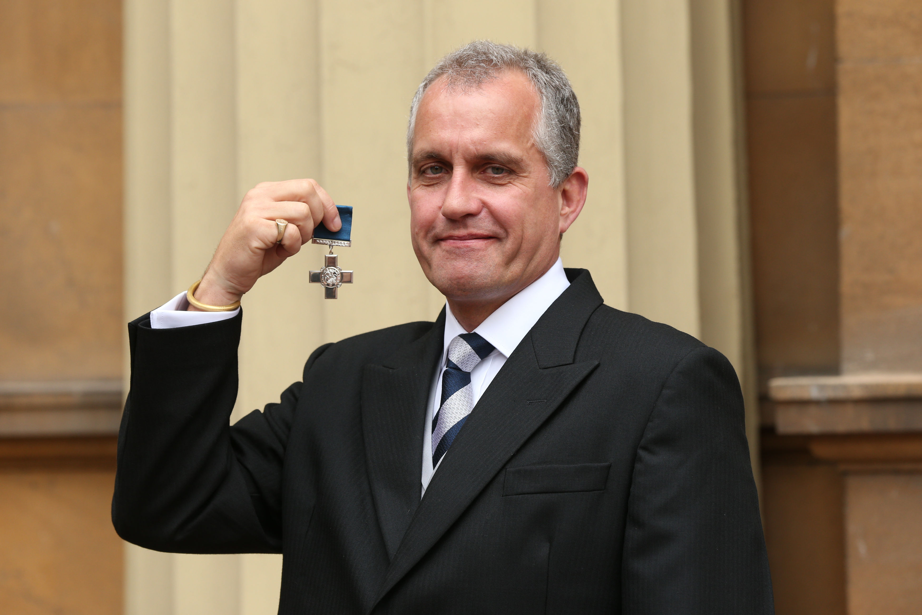 Pictures: PA // Dominic Troulan awarded the George Cross by the Queen