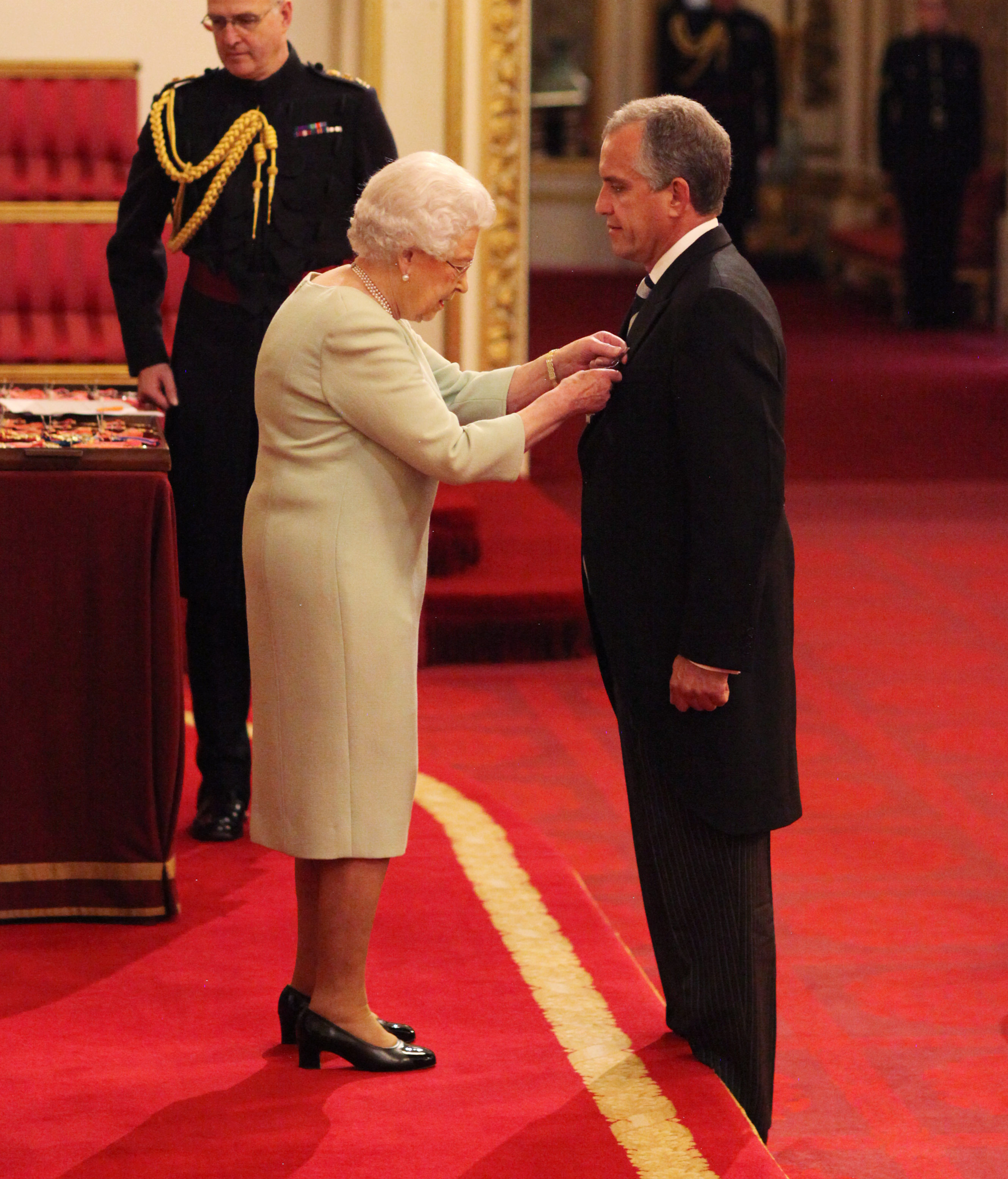 Dominic Troulan being awarded George Cross by Queen 