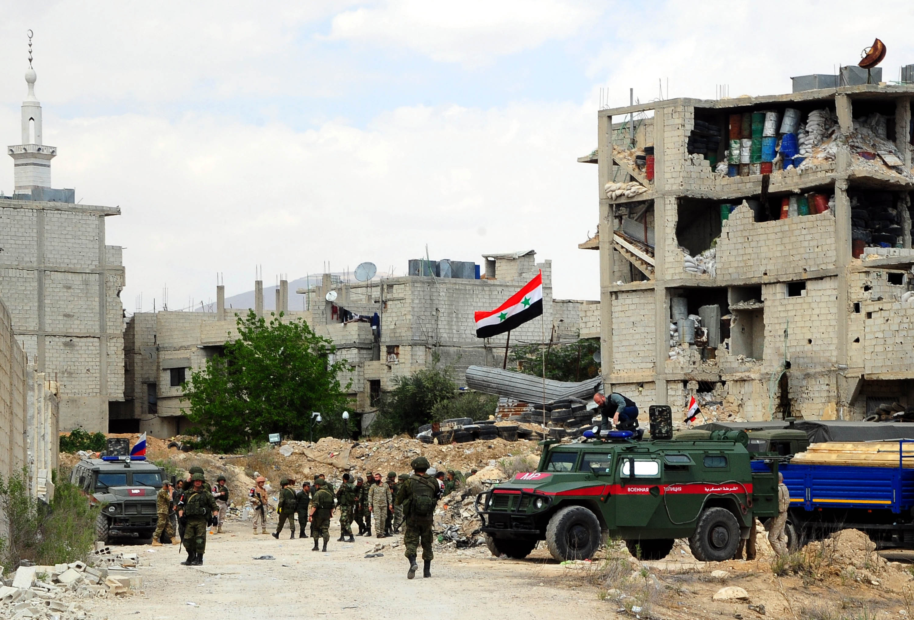 Russian military vehicles enter the Douma district in the eastern countryside of the capital Damascus of Syria, on April 14, 2018. Credit: Ammar Safarjalani/Xinhua News Agency/PA Images