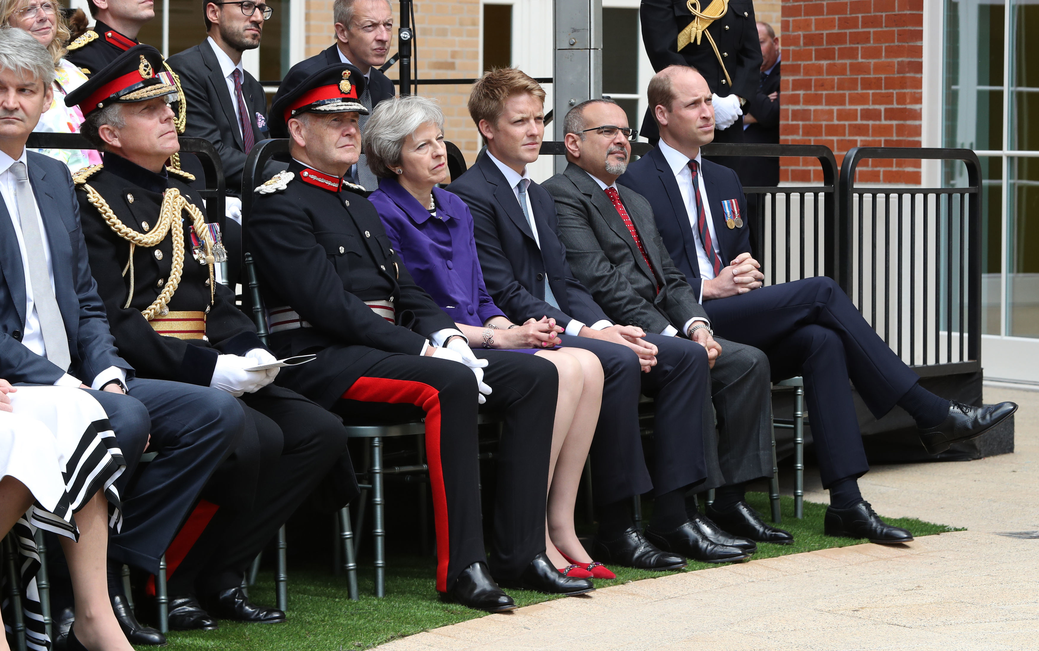 (left to right) Lord Howe, Sir John Peace, Prime Minister Theresa May, Hugh Grosvenor, 7th Duke of Westminster, Prince Salman bin Hamad bin Isa Al Khalifa and the Duke of Cambridge attend the official handover to the nation of the newly built Defence and National Rehabilitation Centre (DNRC) at the Stanford Hall Estate, Nottinghamshire.