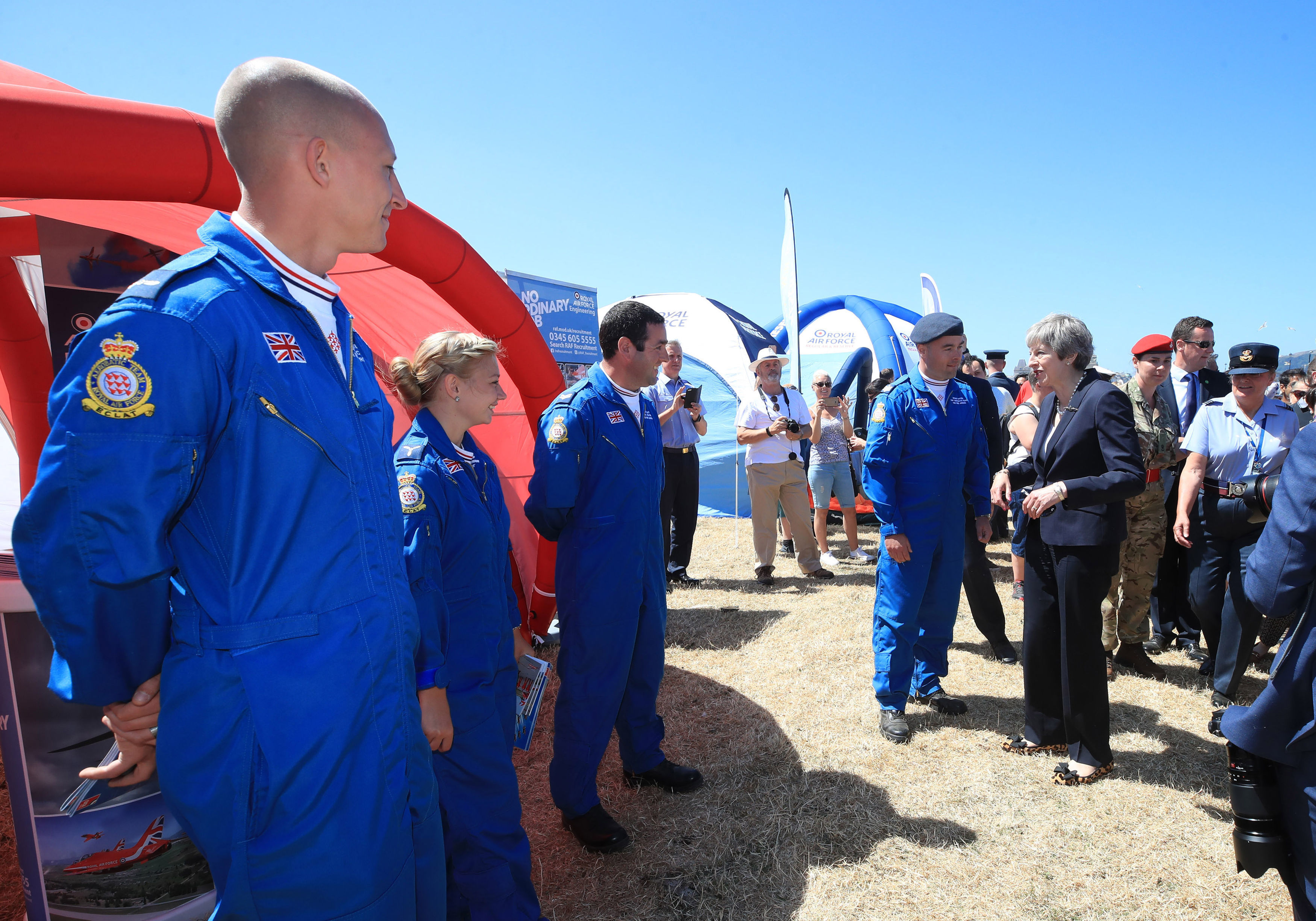 Prime Minister Theresa May meets members of the Red Arrows the Royal Air Force Aerobatic Team during the celebrations for National Armed Forces Day in Llandudno