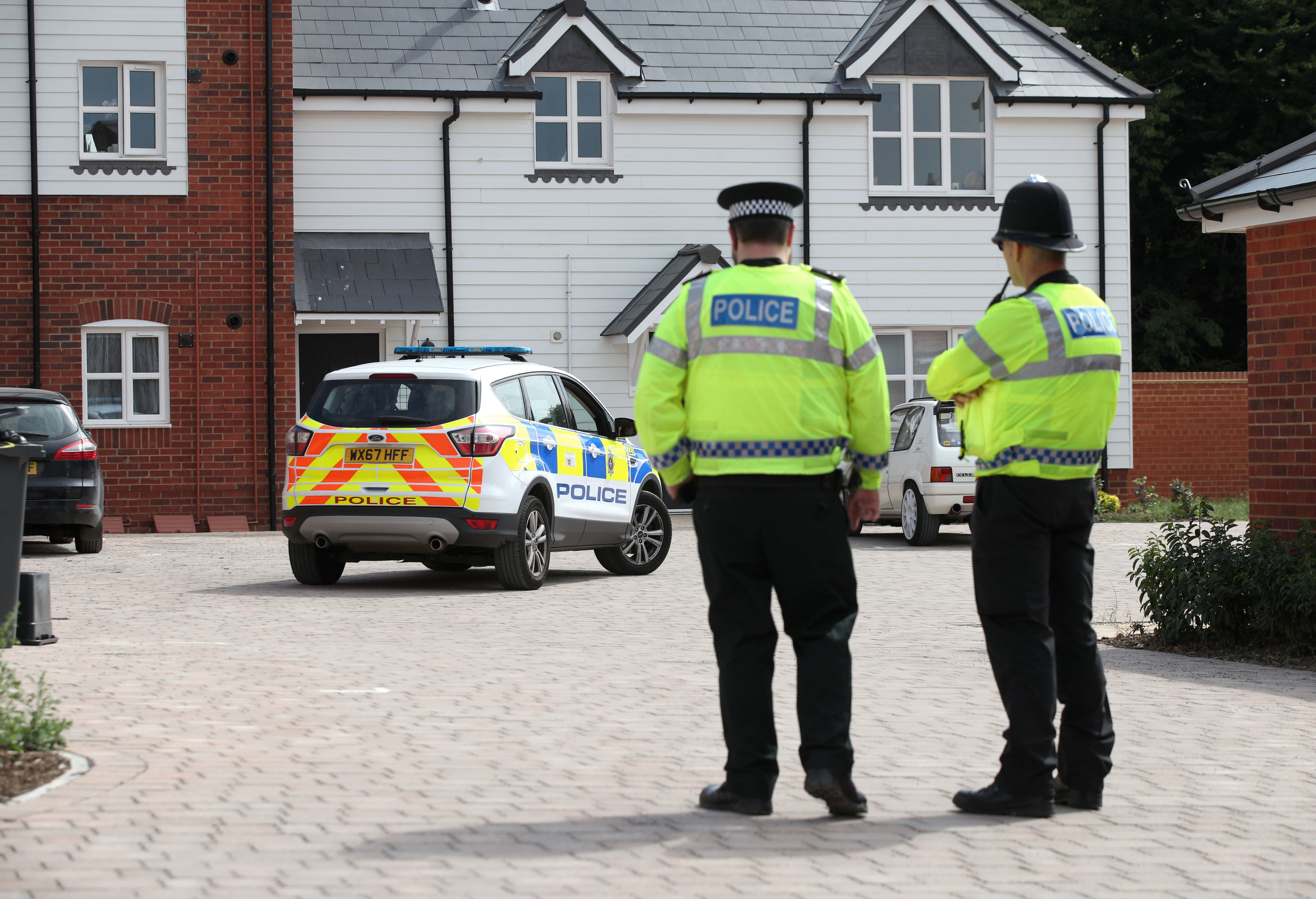 Police outside the home where Mrs Sturgess and Mr Rowley were found (Picture: PA).