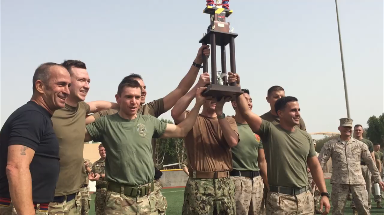 The winners lifting the trophy