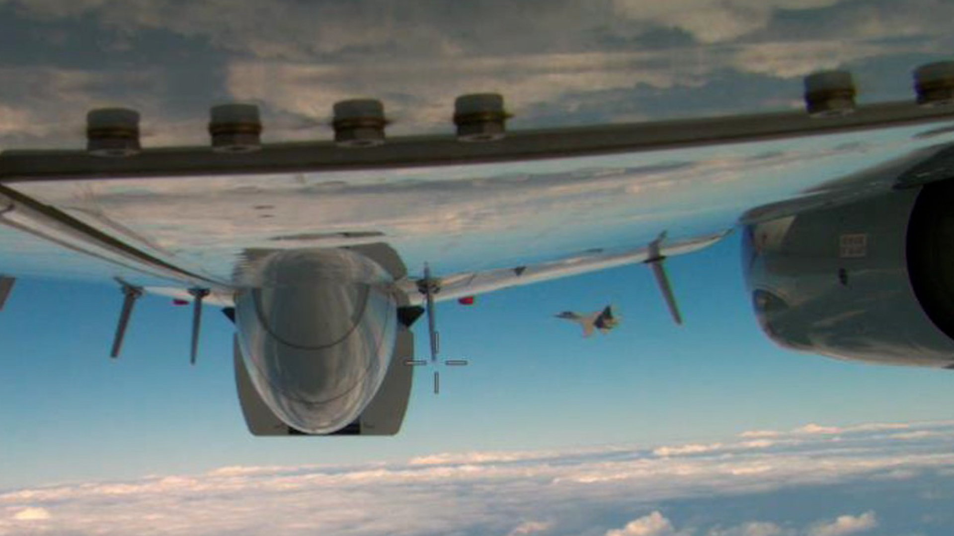 PLA fighter jet crossing in front of US aircraft CREDIT US Department of Defense