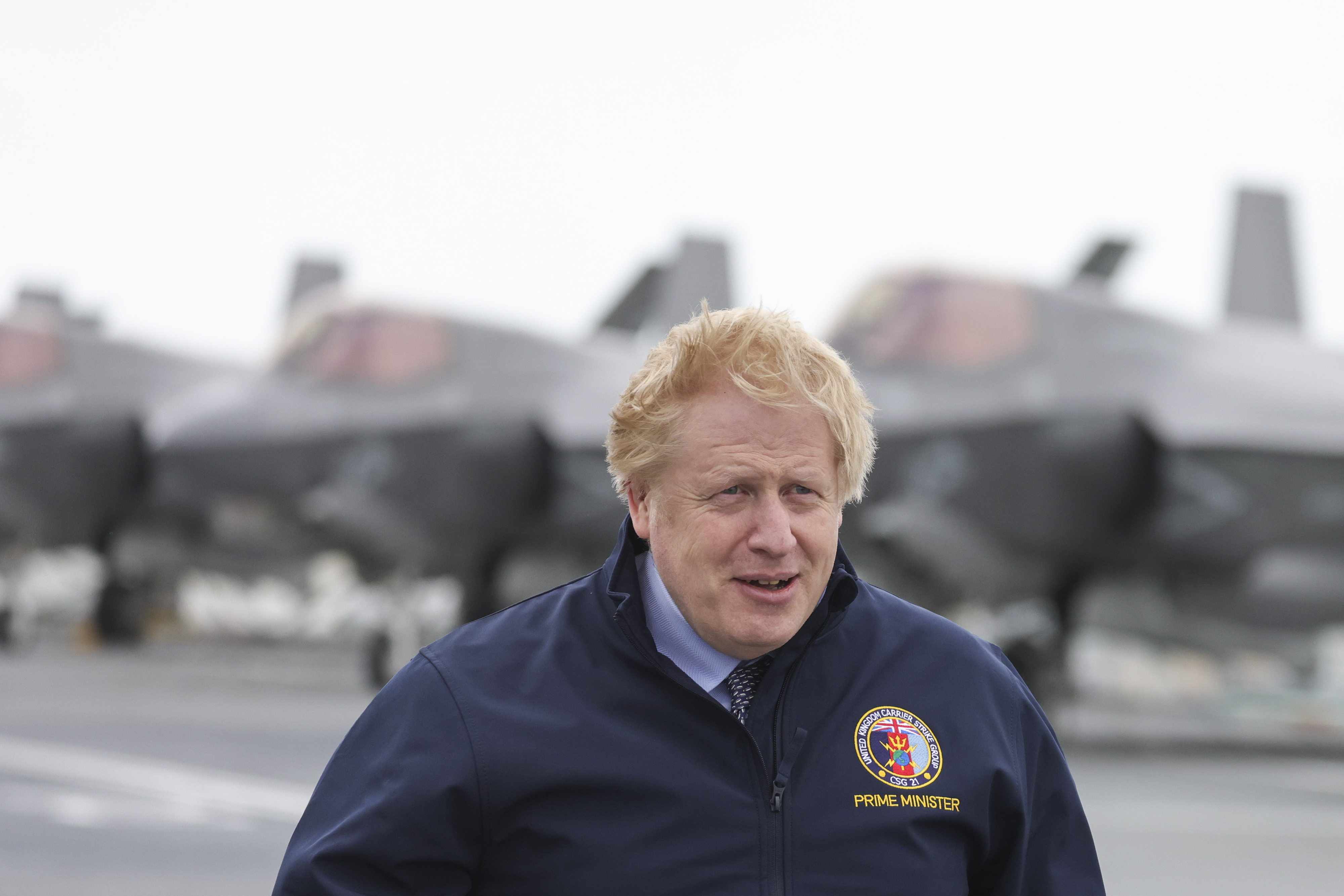 PM Boris Johnson looks on as he stands on the deck of aircraft carrier HMS Queen Elizabeth in Portsmouth 210521 CREDIT NUMBER 10 FLICKR