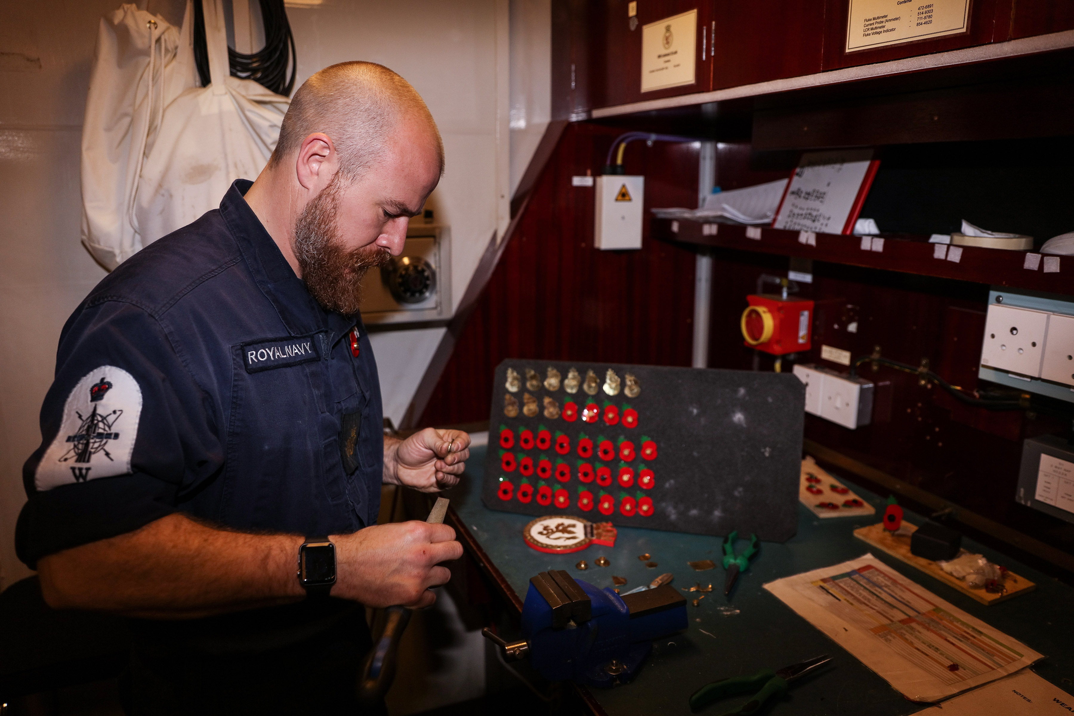 PO Andy Kirkaldy turning shell casings into poppies for shipmates on HMS Sutherland 261020 CREDIT ROYAL NAVY