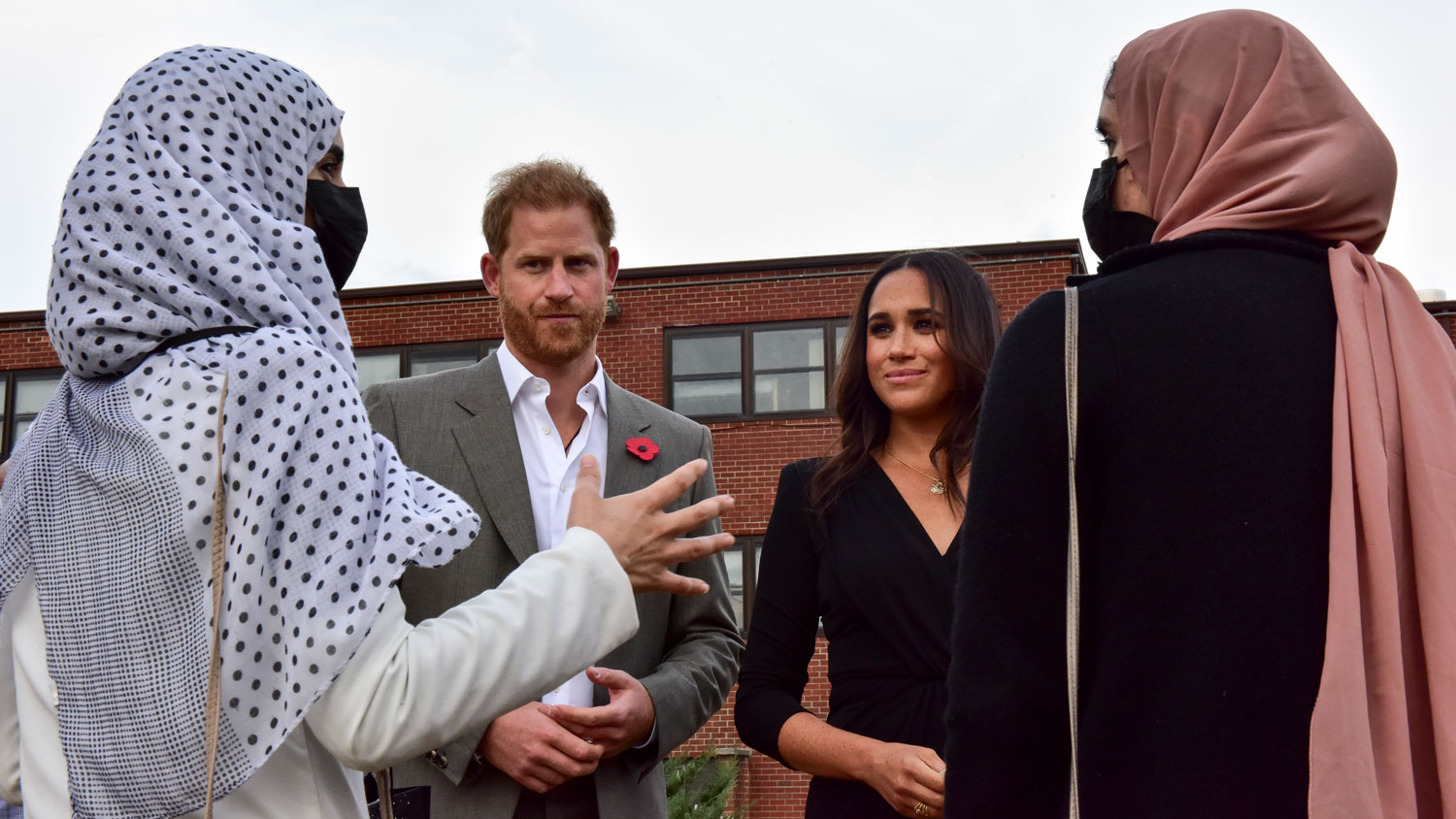 Prince Harry and Meghan speak with two Afghan women during a visit to Liberty Village on Joint Base McGuire-Dix-Lakehurst, New Jersey CREDIT US Air Force DVID Image ID 6938127