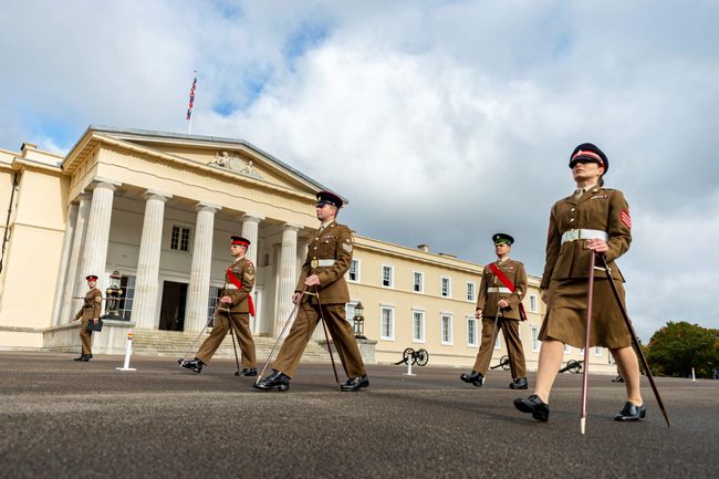 Soldier cadets practice marching with pace sticks at Sandhurst military academy