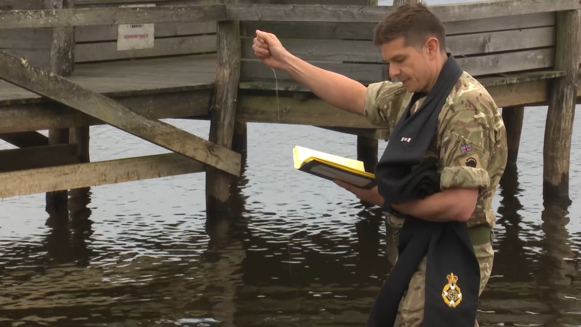 Padre Ben Norton conducts baptism in Danish Lake credit bfbs 10.10.19