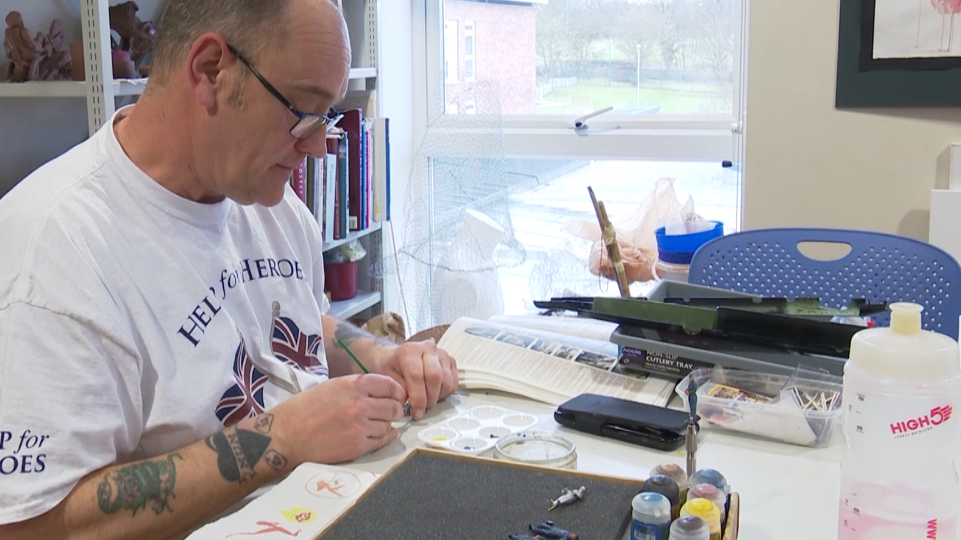 Paul Metcalf painting a model 150219 CREDIT BFBS.jpg