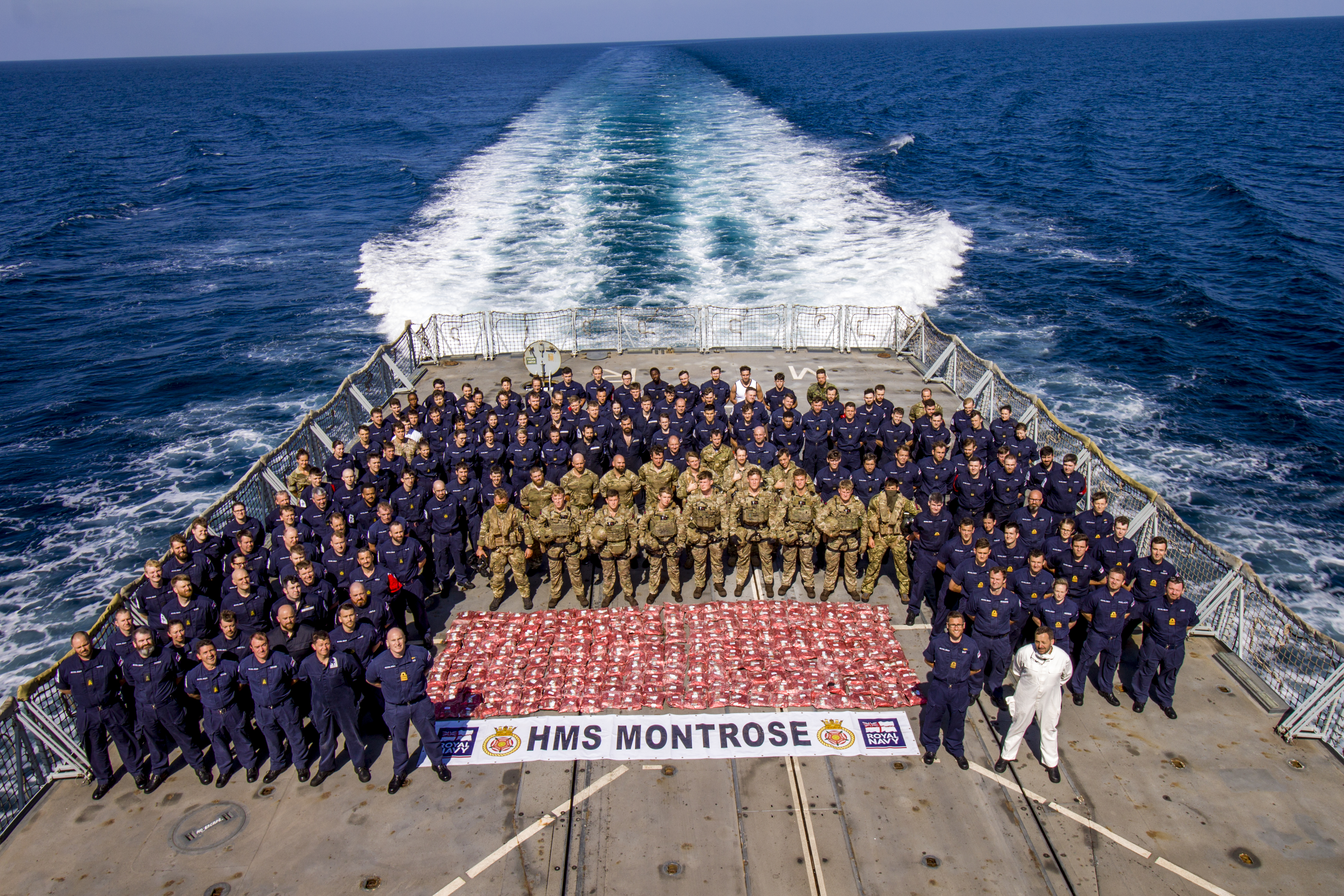 Personnel aboard HMS Montrose having seized £11m worth of drugs in the North Arabian Sea
