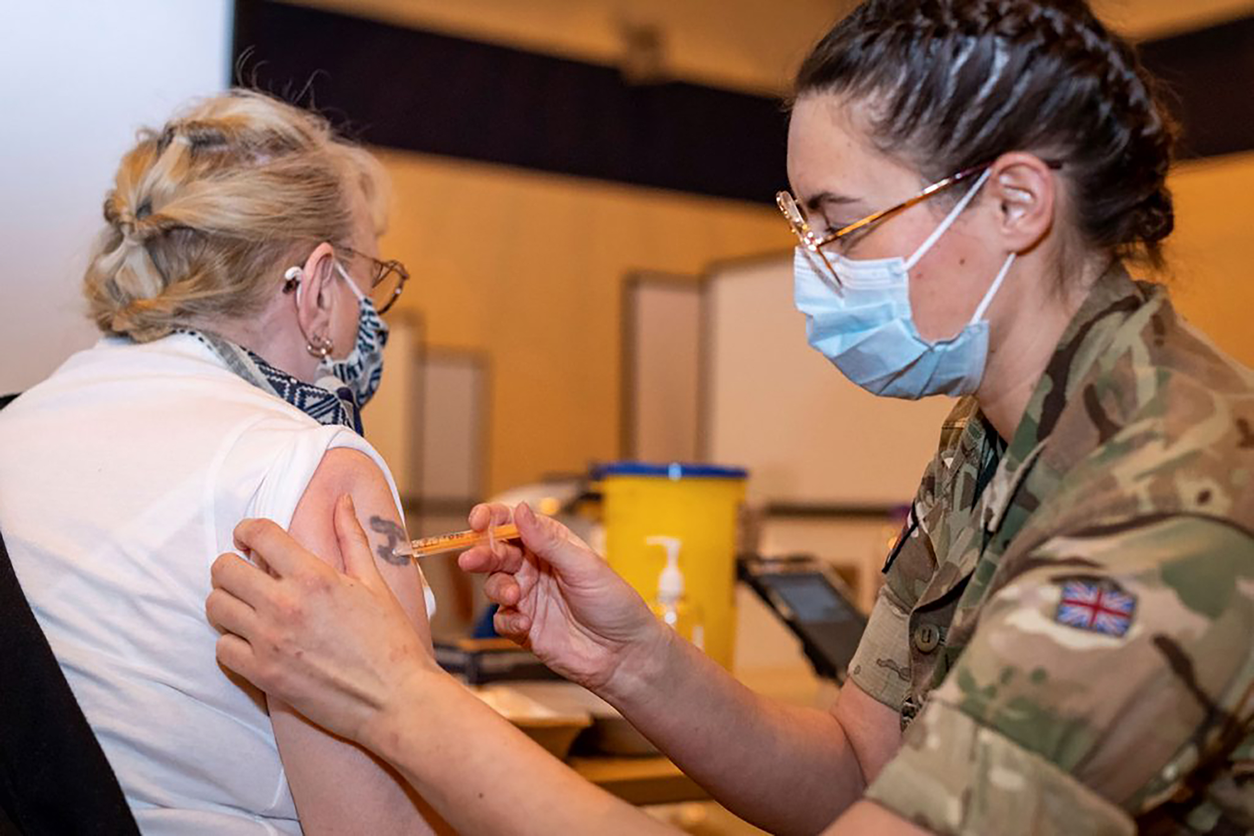 Personnel administering vaccine in Scotland