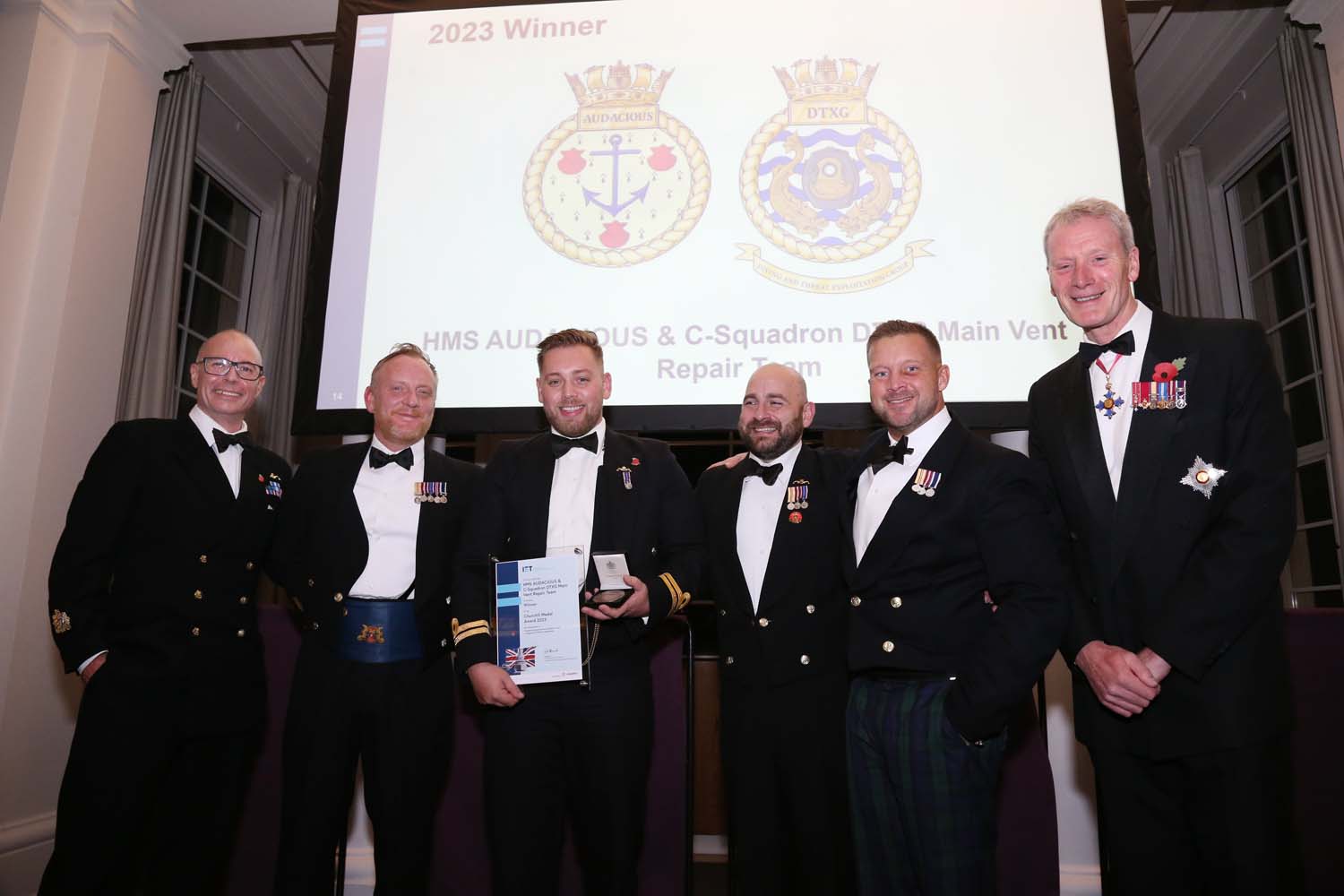 Personnel from HMS Audacious after being given The Churchill Award for completing underwater repairs on the submarine 141123 CREDIT MOD.