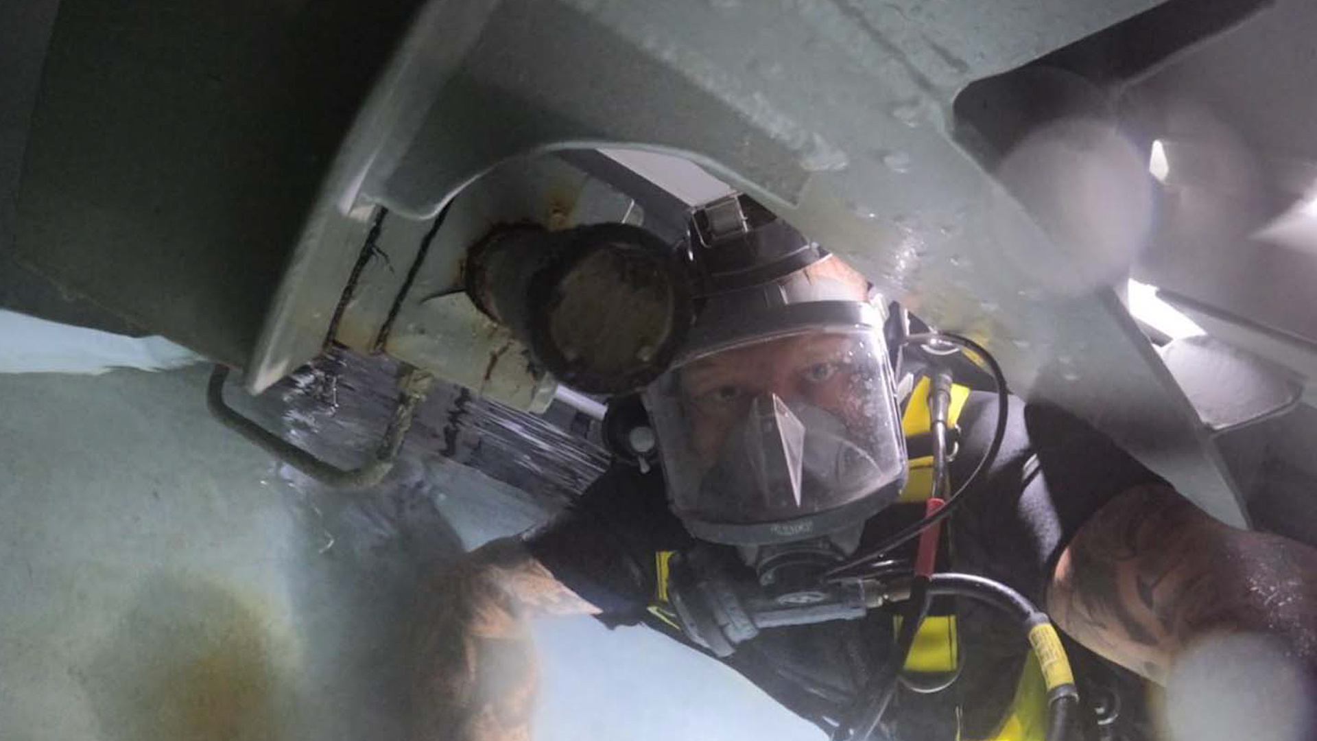 	Personnel from HMS Audacious completing underwater repairs on the submarine which saw them given The Churchill Award 