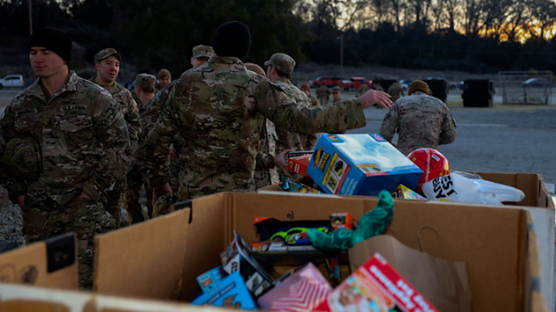 Personnel from the US, UK, Chile and Germany collecting toys as part of Operation Toy Drop 181223 CREDIT UK Defence Staff in US Twitter.j