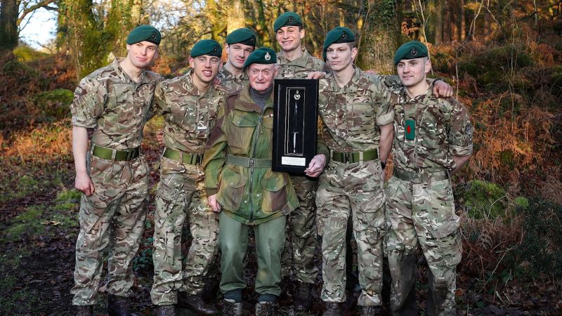 Peter White Royal Marine legend poses with royal marines