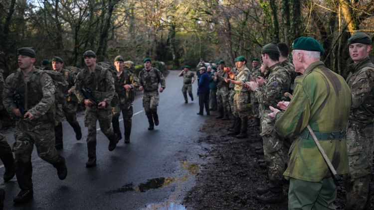 Peter White claps Royal Marines during Dartmoor Challenge