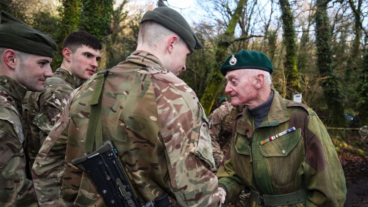 Peter White former royal marine shakes hands after 309 dartmoor challenge