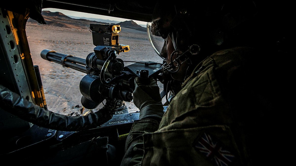Pictured is an RAF Chinook Weapon Systems Operator, or Door Gunner manning his M134 Mini Gun on Exercise Black Alligator date 21092016 CREDIT MOD.jpg