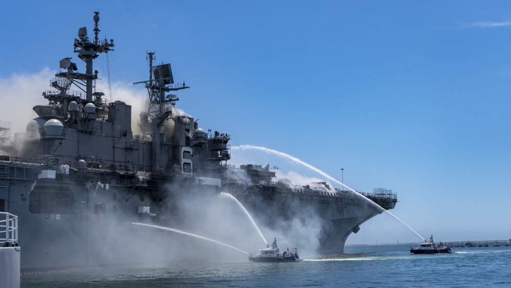 Port of San Diego Harbor Police Department boats combat a fire on board USS Bonhomme Richard