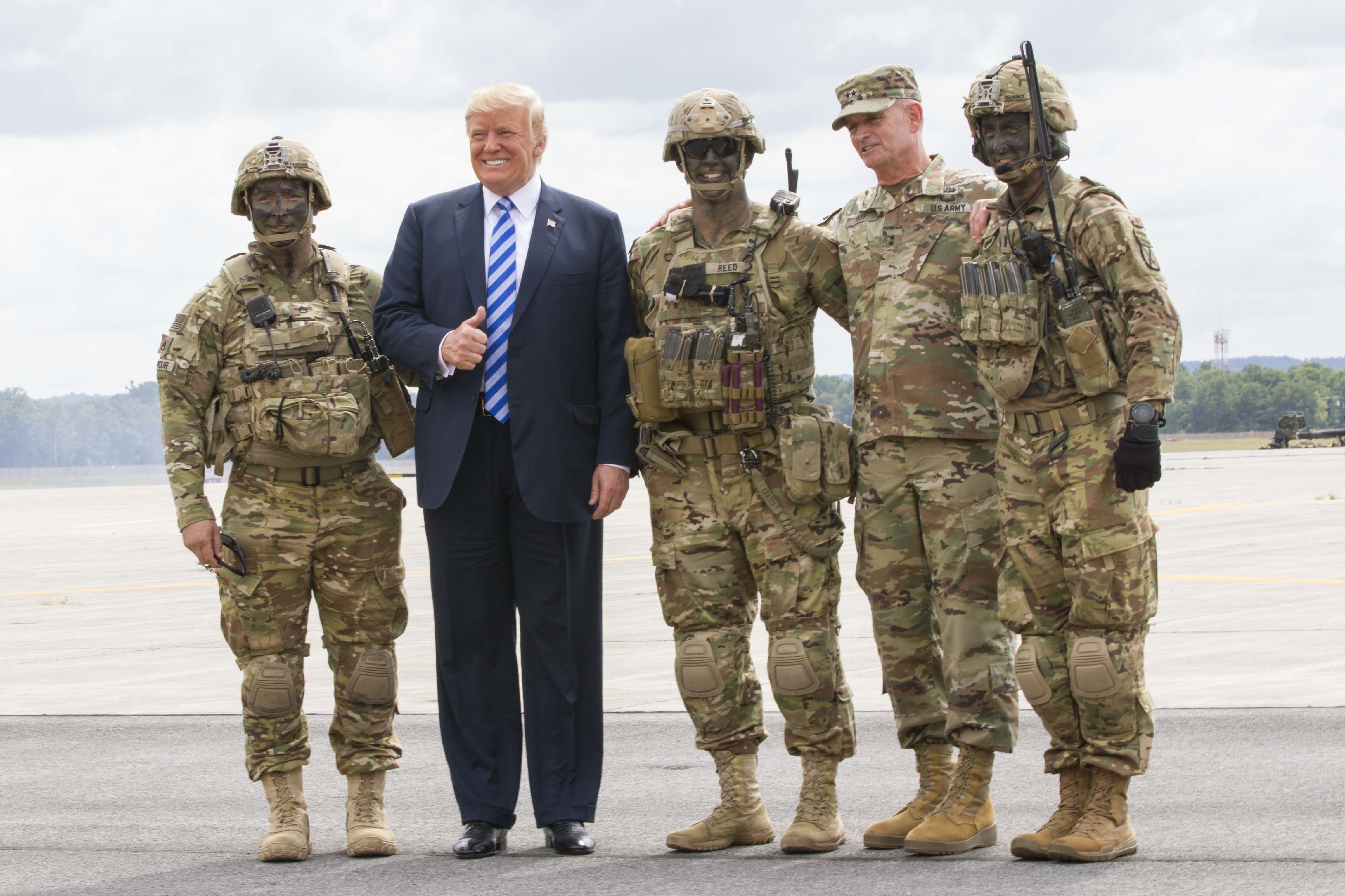 President Donald J. Trump poses with Maj. Gen. Walter E. Piatt, commander of the 10th Mountain Division, and Soldiers following an air assault and gun raid demonstration at Fort Drum, New York, Aug 13 CREDIT DVIDS.jpg