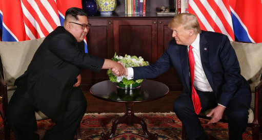 President Trump and Kim Jong-un shake hands (Picture: PA).
