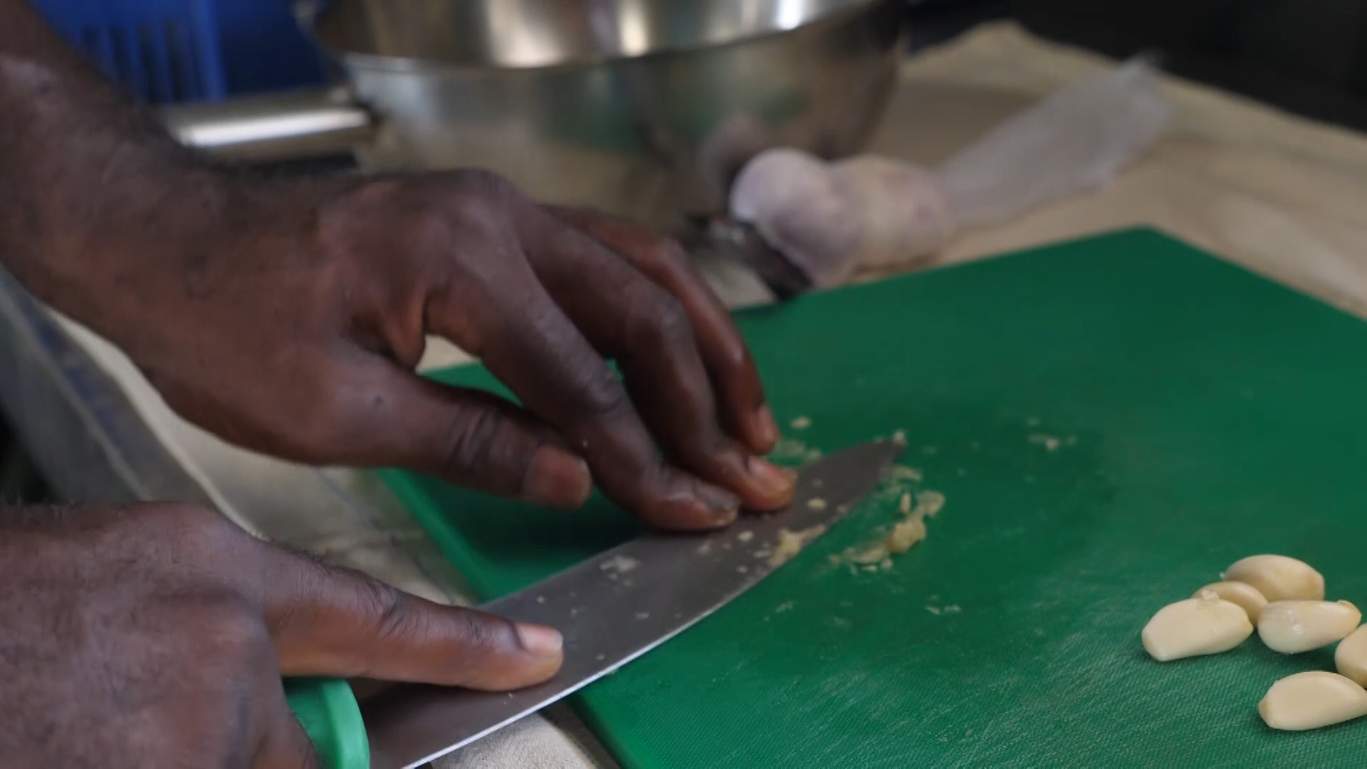 Pressing garlic as 167 Regiment cooks in Cyprus.