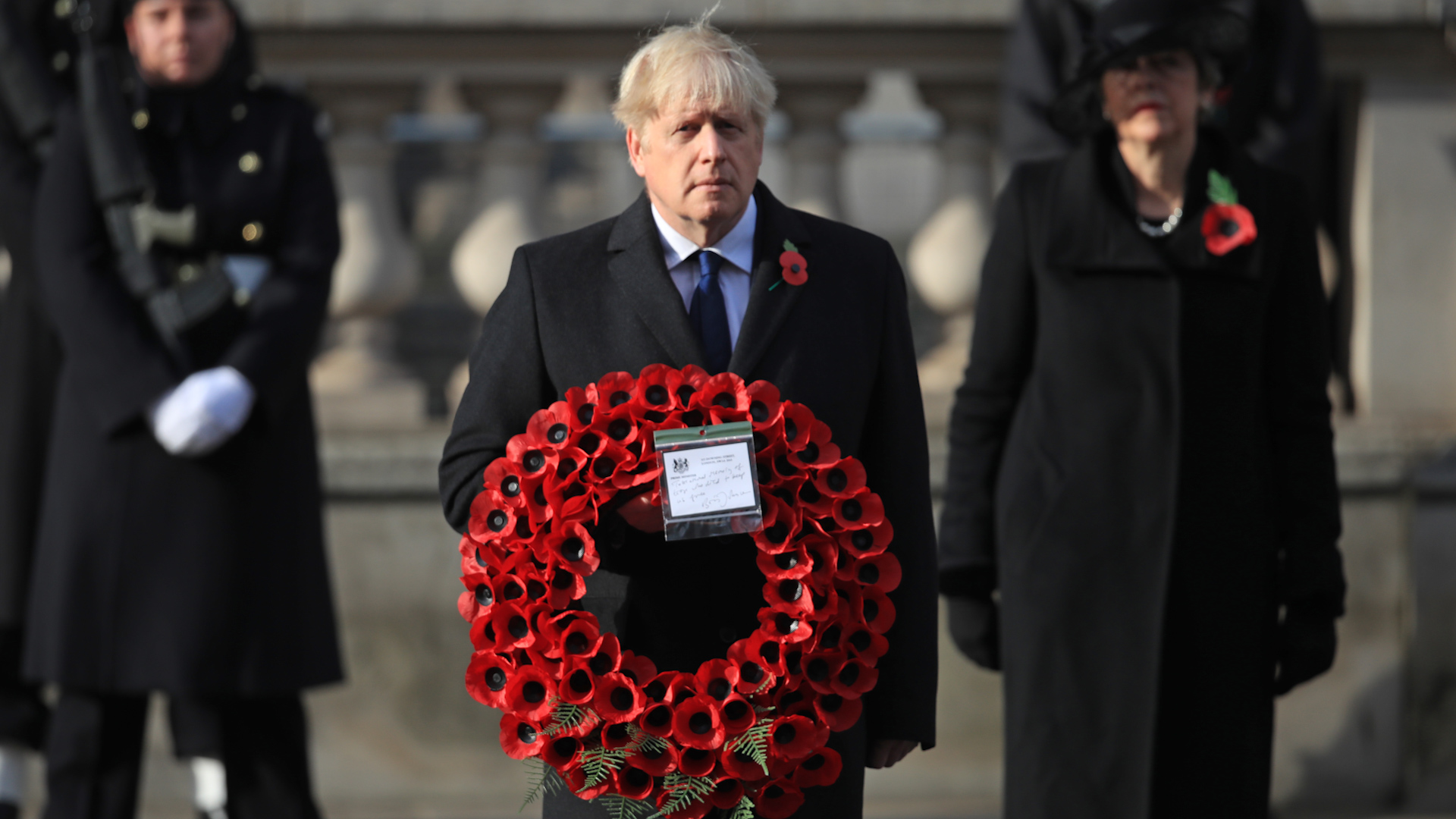 Mr Johnson laid a wreath during the ceremony at the Cenotaph (Picture: PA).