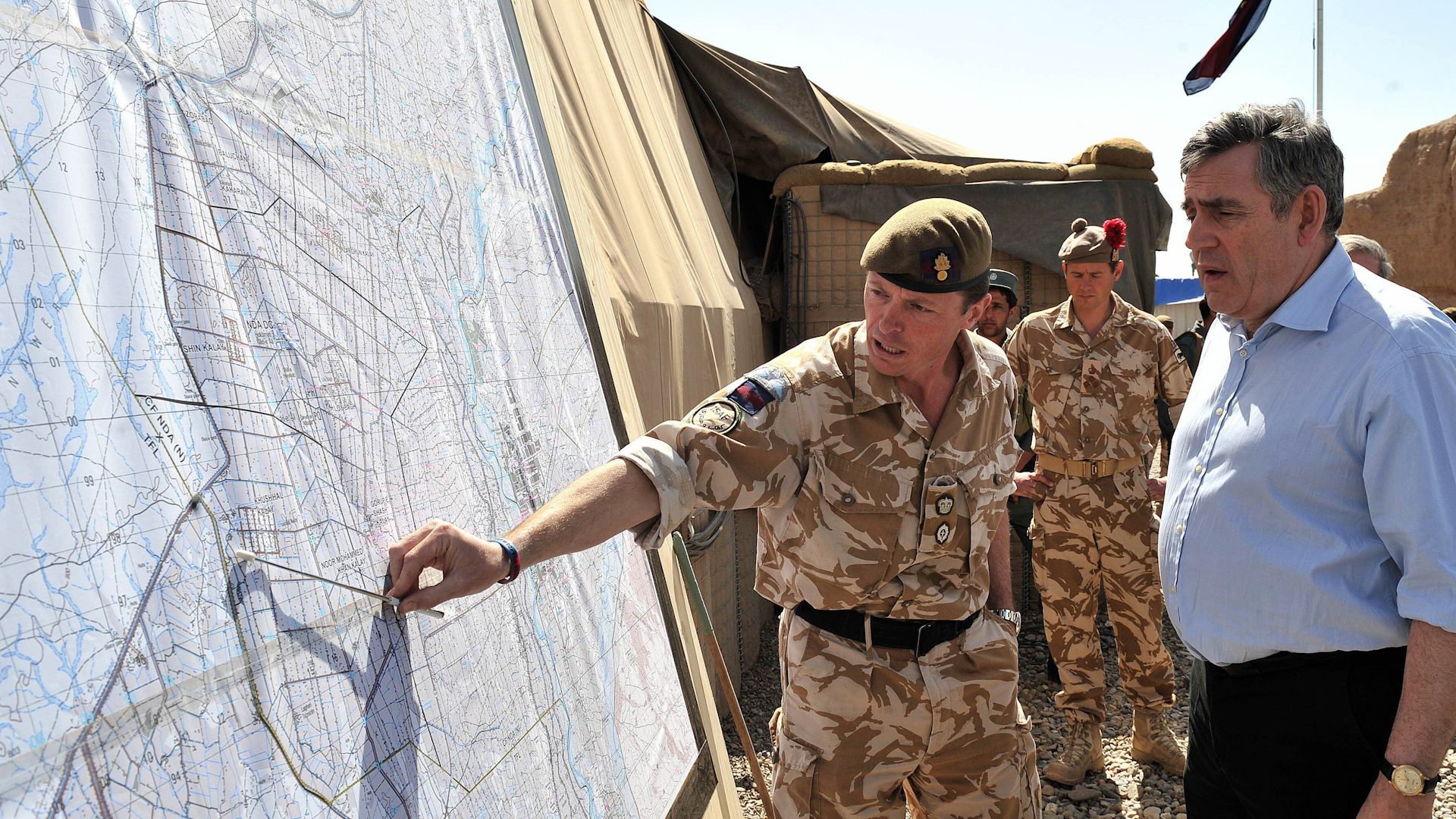 Prime Minister Gordon Brown is shown a map of Helmand Province by lieutenant colonel Roly Walker 