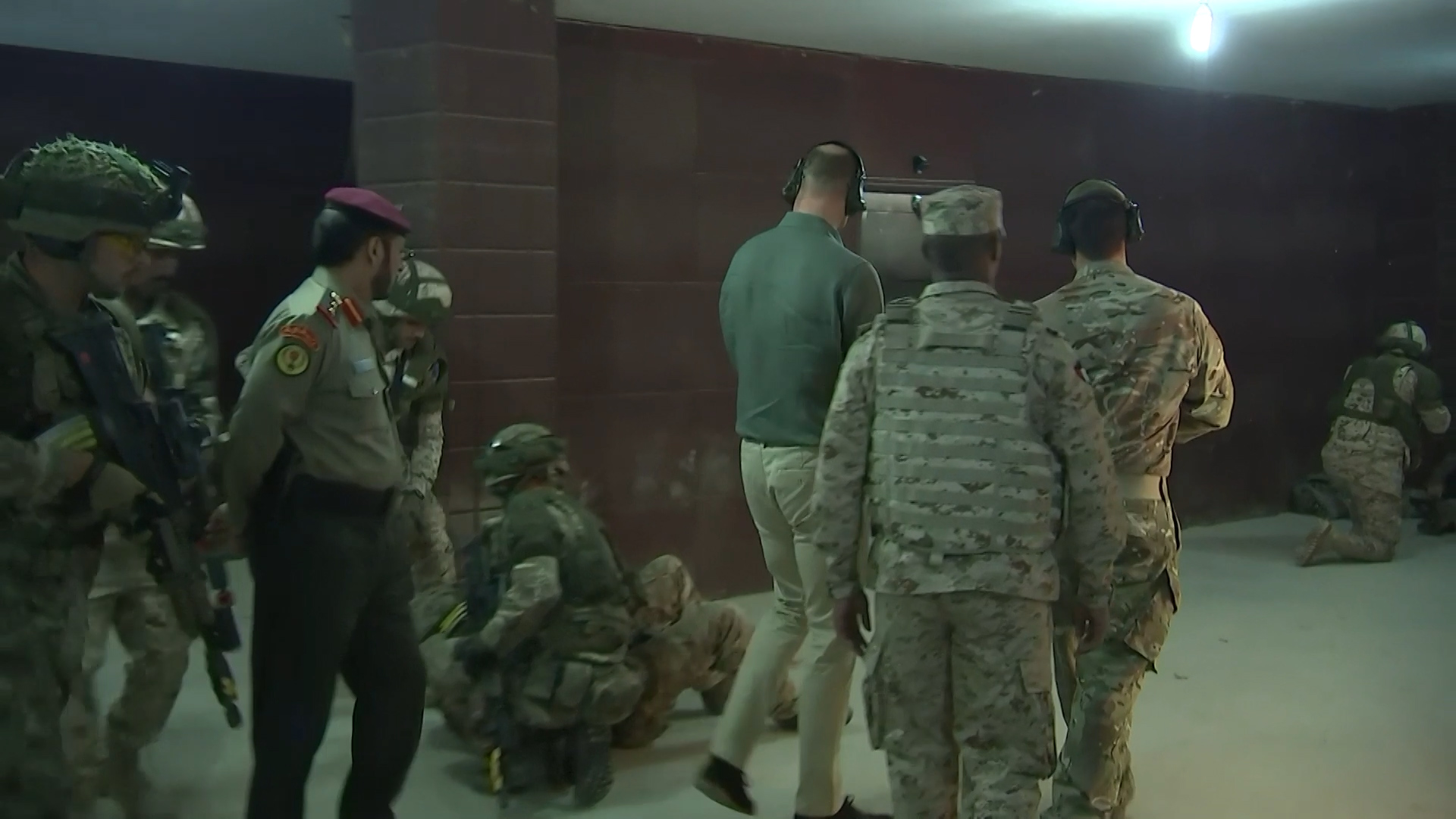 Prince William watches shooting drills inside a building on Ex Desert Warrior.