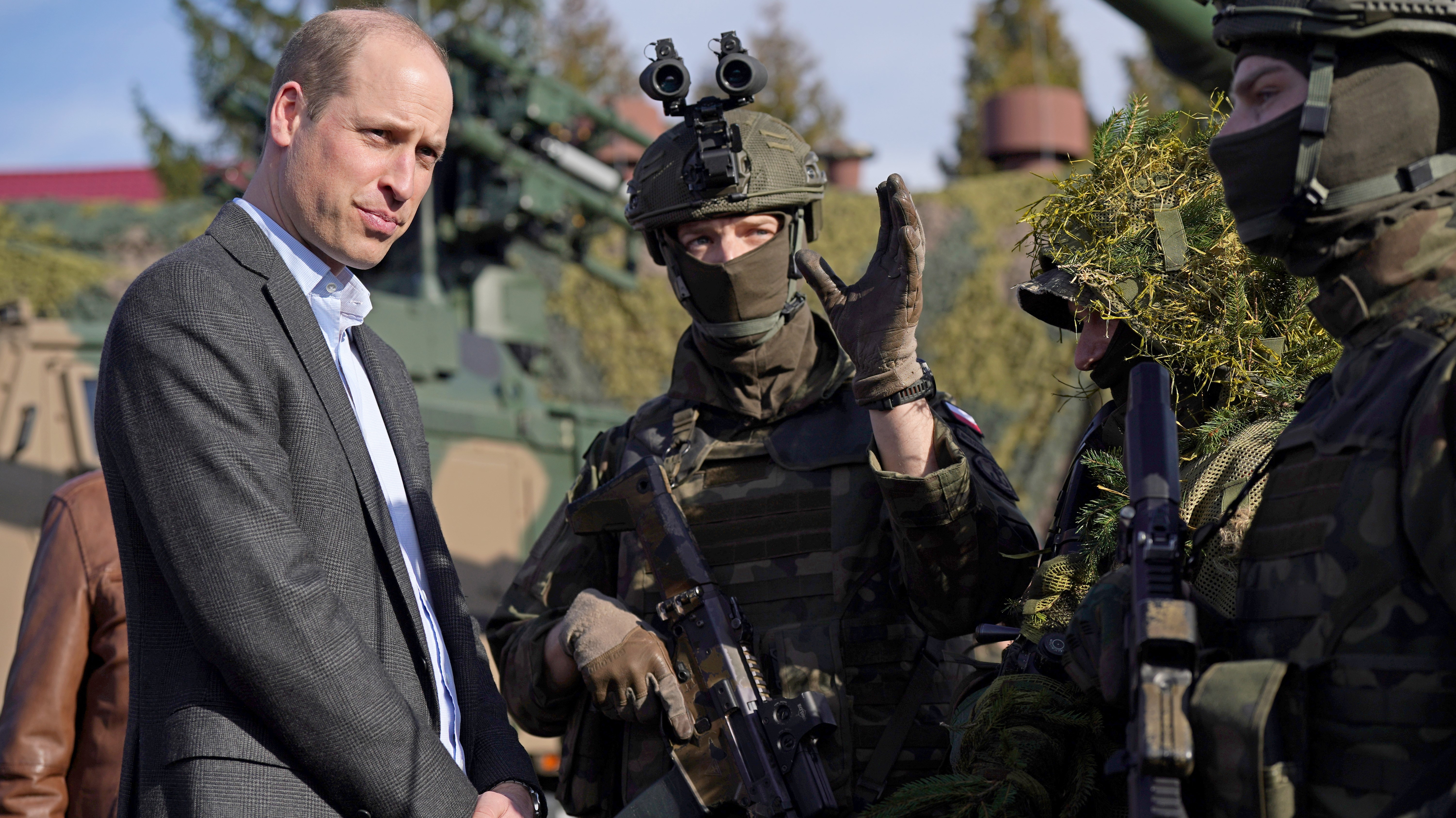 Prince of Wales meeting members of the Polish military during a visit to the 3rd Brigade Territorial Defence Force base in Poland 220323 NO REUSE CREDIT PA WIRE, PA IMAGES