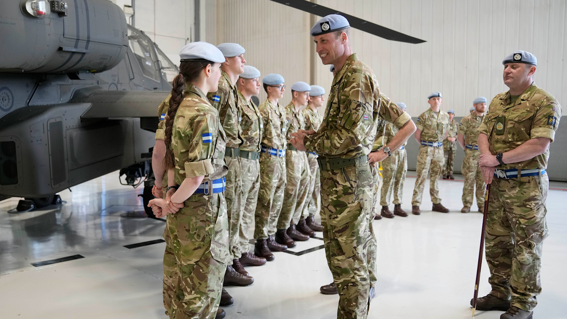 Prince of Wales talks with service personnel at the Army Aviation Centre in Middle Wallop