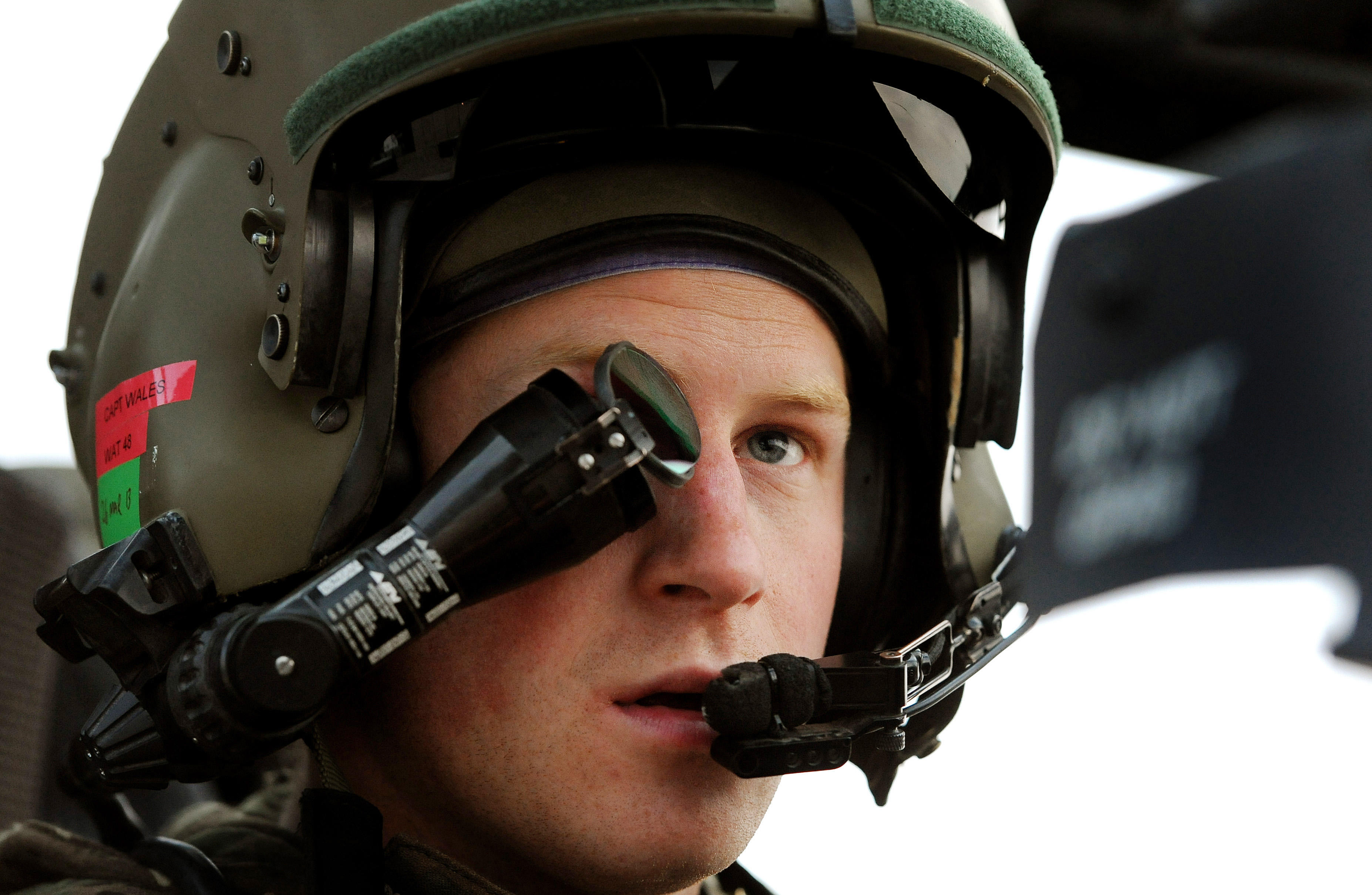 Image ID: DY775H: Prince Harry wears a  monocle gun sight as he sits in the front seat of his cockpit while serving as an Apache Helicopter Pilot/Gunner in 2021 (Picture: WENN Rights Ltd / Alamy).