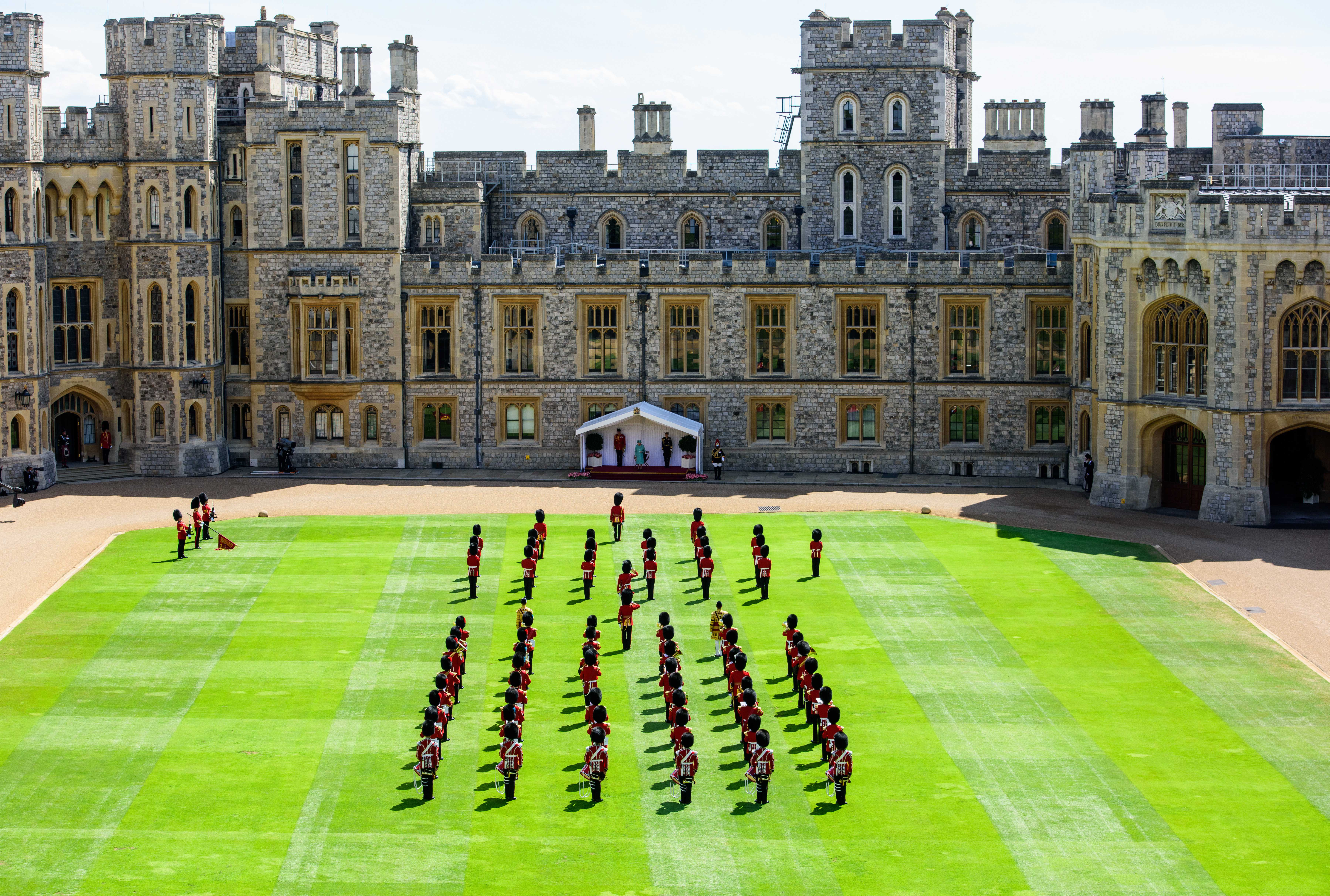 Queen Elizabeth II watches a ceremony in the Quadrangle of Windsor Castle in Berkshire to mark her official birthday 130620 CREDIT PA