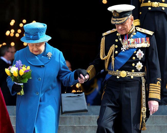 Queen and Prince Philip holding hands while leaving St Paul's Cathedral 130315 CREDIT MOD