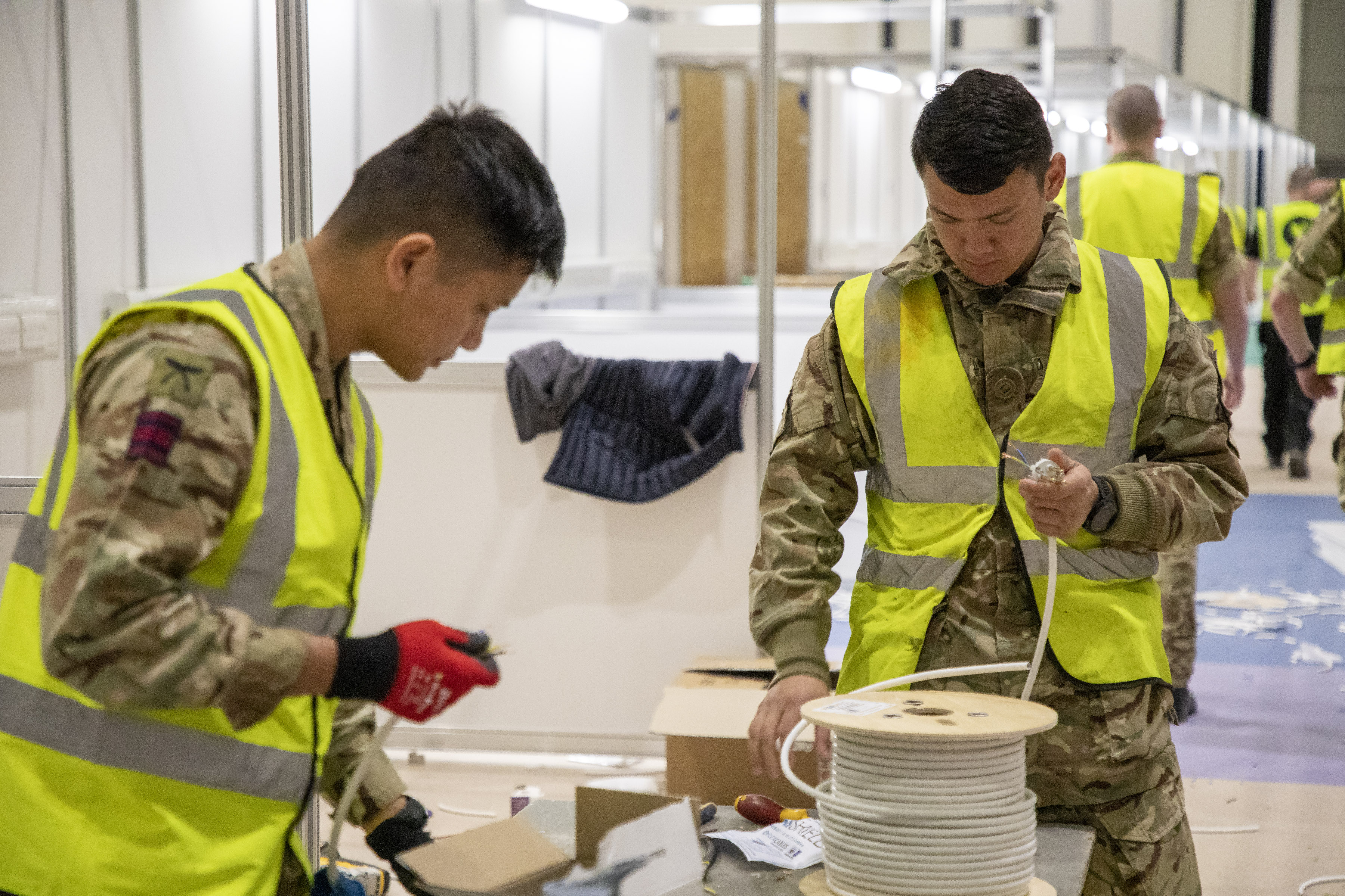Soldiers of the Queen’s Gurkha Engineer Regiment contributed to the building of the Nightingale Hospital at The Excel centre, London, in 2020. Credit: MOD
