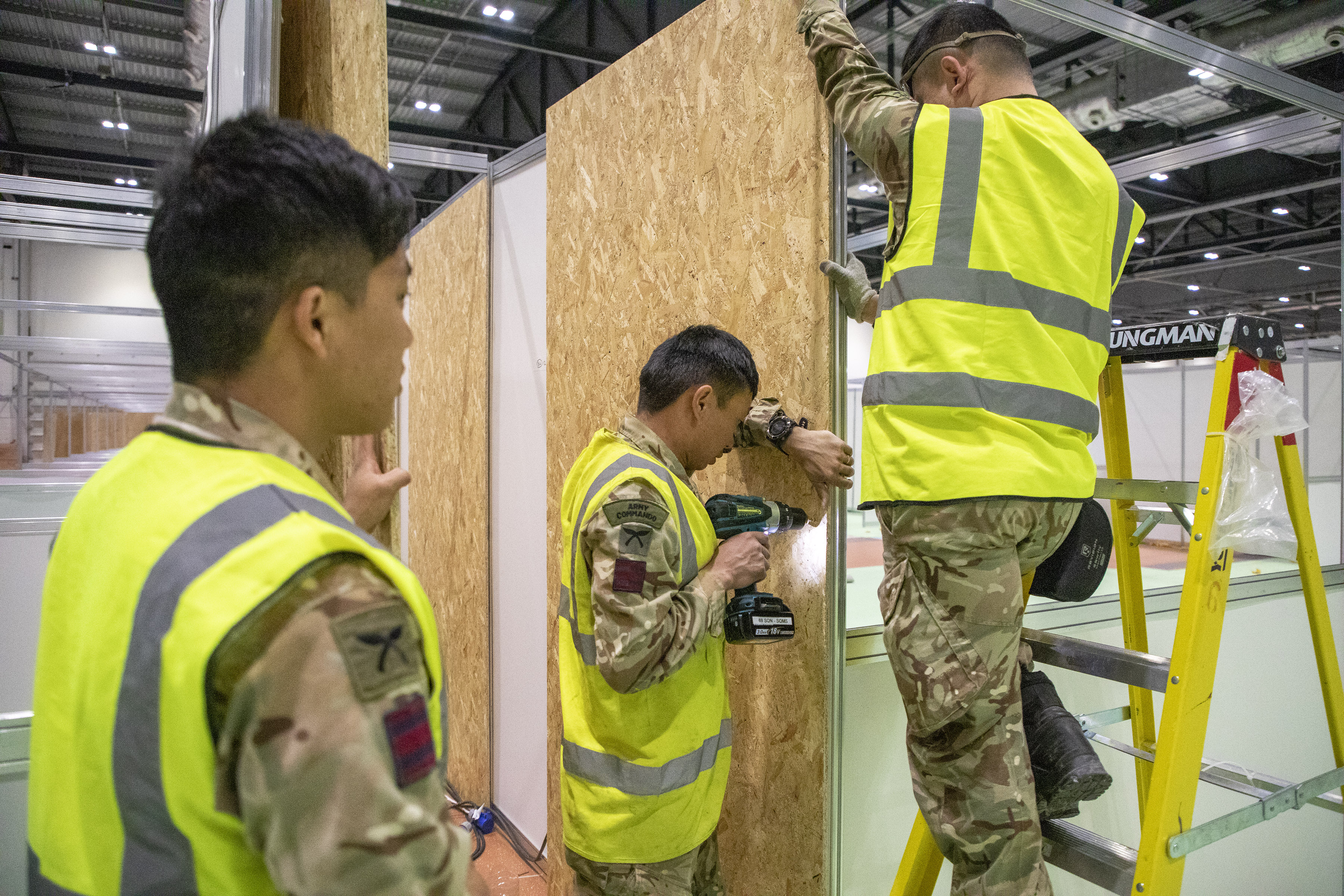Cover image: Soldiers help build NHS Nightingale in London (Picture: MOD).