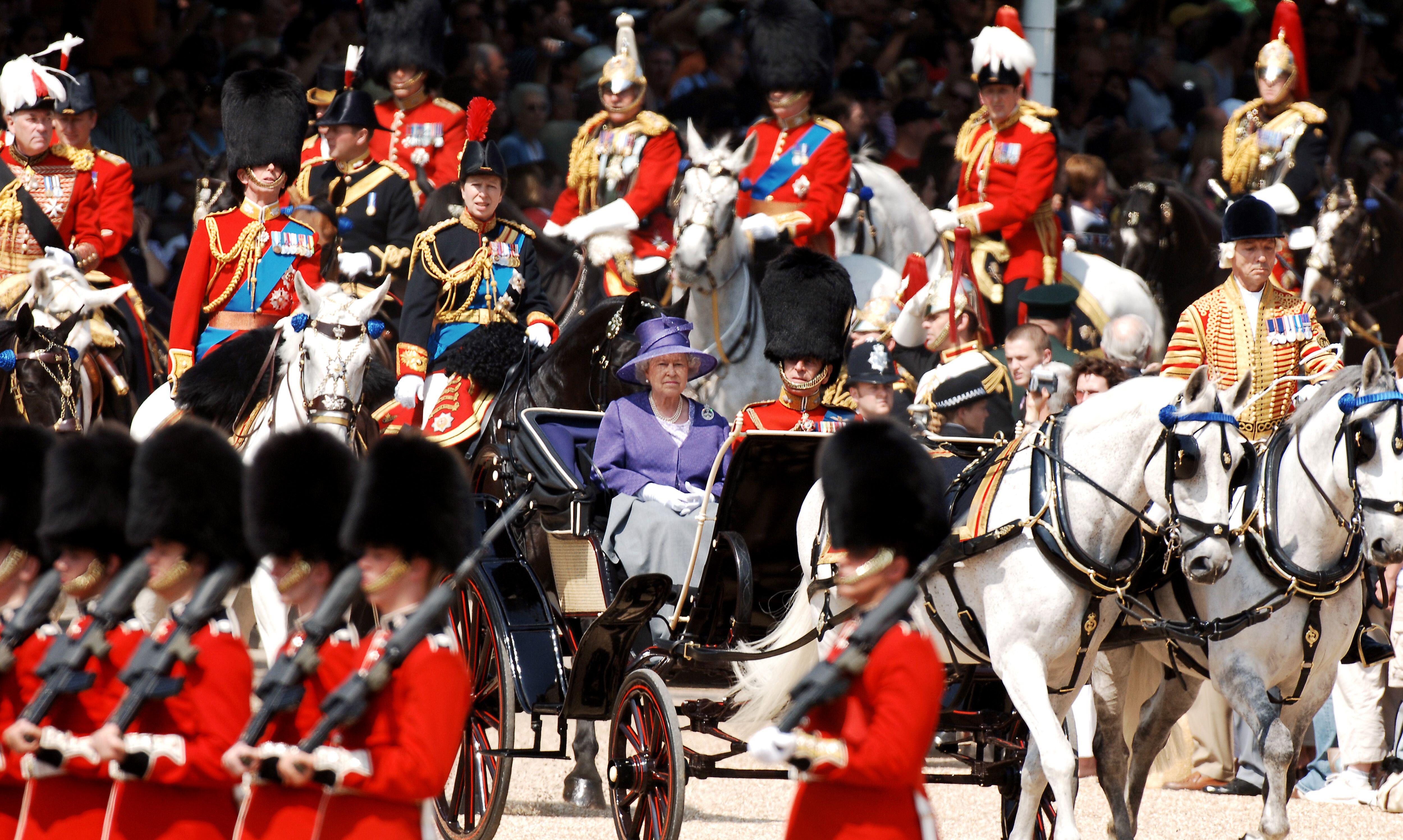 Queen Elizabeth II, pictured with the late Duke of Edinburgh, as they arrived to inspect the troops during the annual Trooping the Colour ceremony at Horse Guards Parade, London, in 2006 (Picture: PA Images / Alamy).